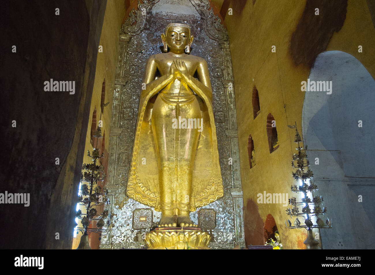 Huge south facing standing Kassapa Buddha,4 statues facing cardinal directions,Ananda Buddhist temple Pagan,Bagan,Burma,Myanmar Stock Photo