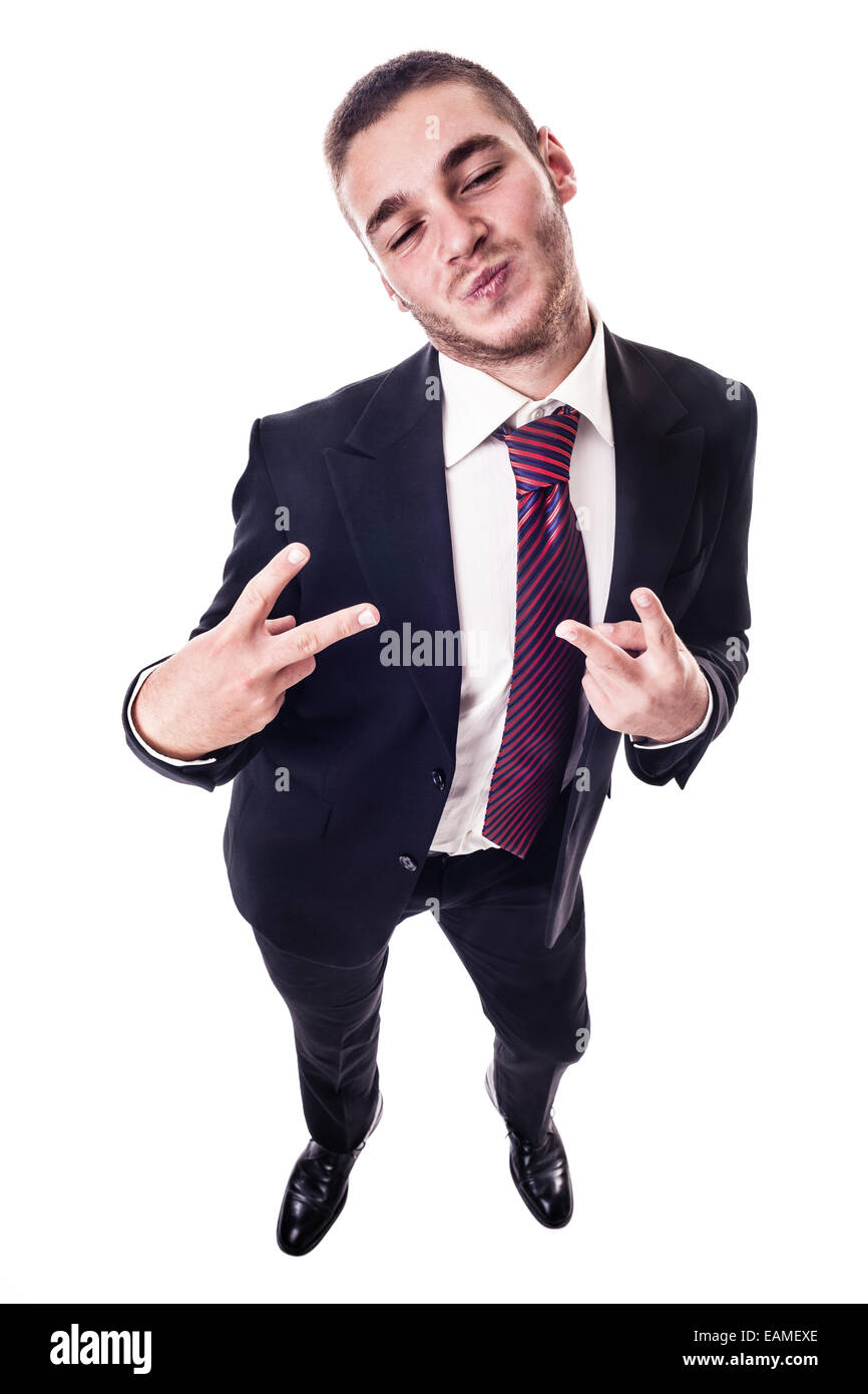 a young businessman making the peace sign and a silly face isolated over a white background Stock Photo