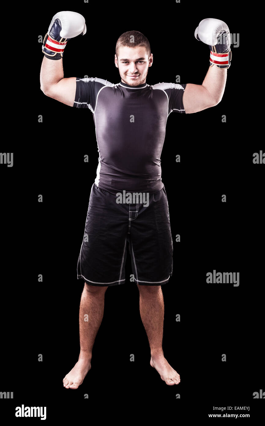 a young kickboxer or boxer isolated over a black background Stock Photo