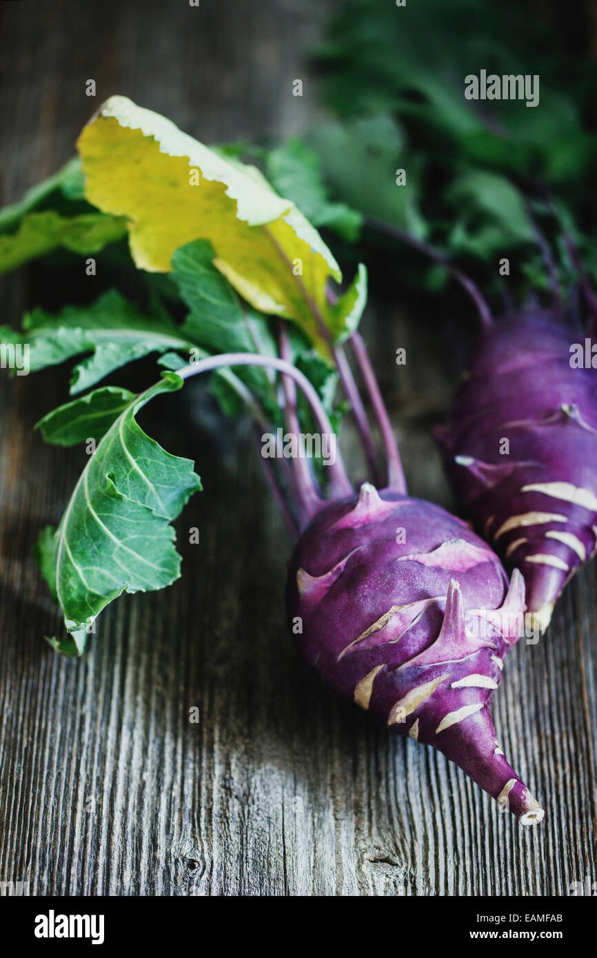 Kohlrabi cabbage on dark wooden background Stock Photo