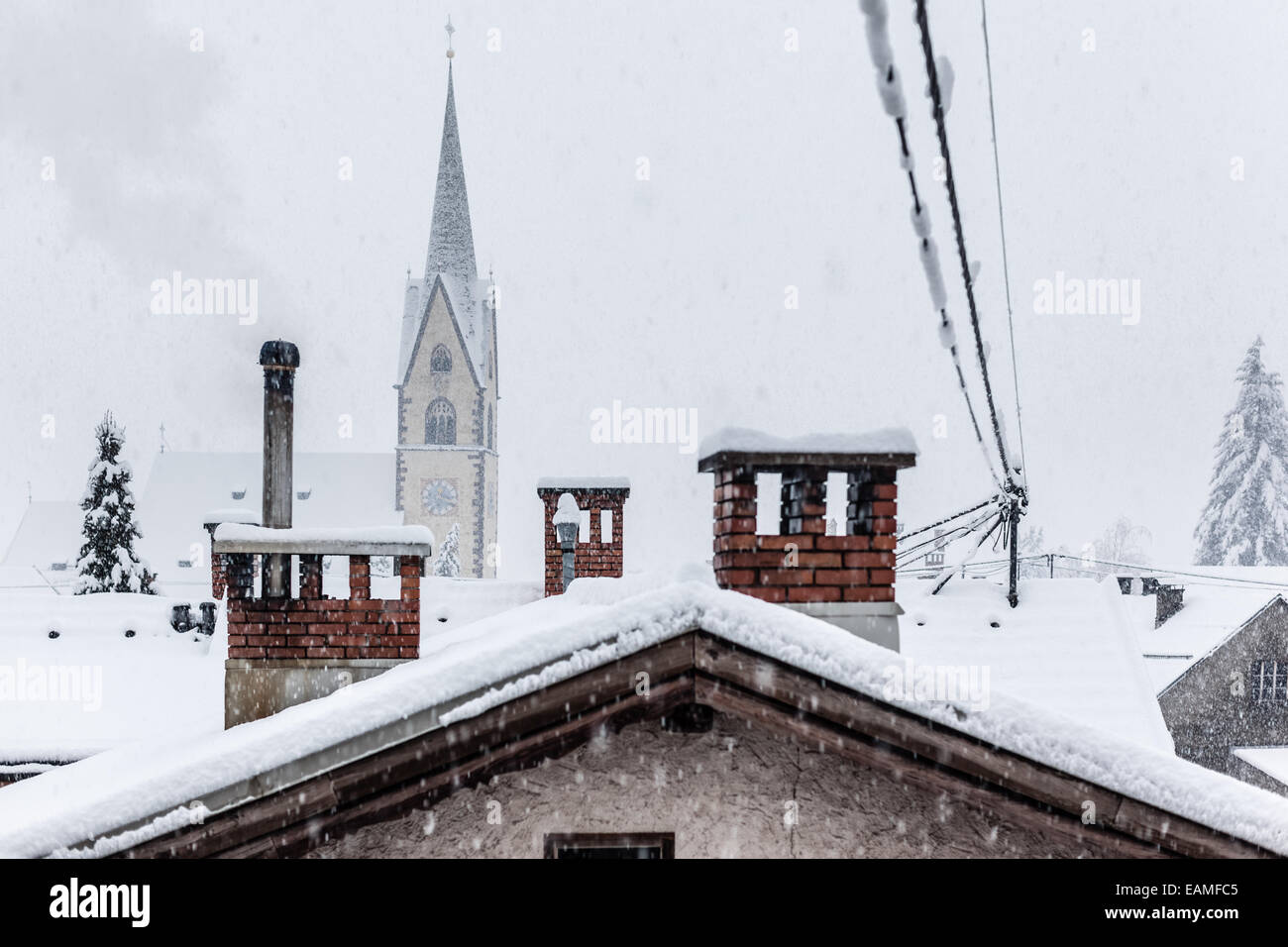 a small austrian town heavily covered with snow after a blizzard Stock Photo