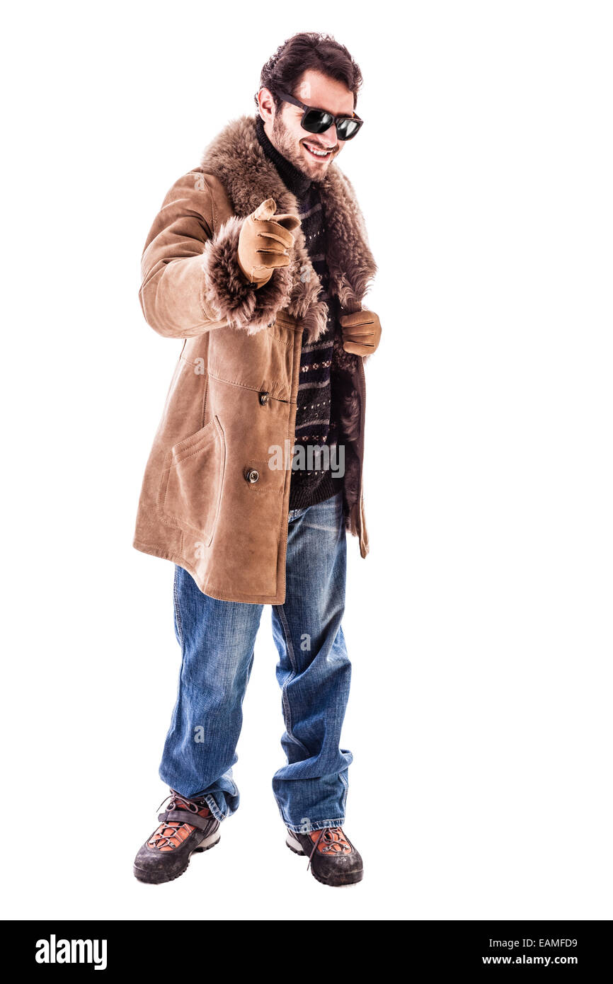 a cheerful young man wearing an expensive sheepskin furry coat isolated