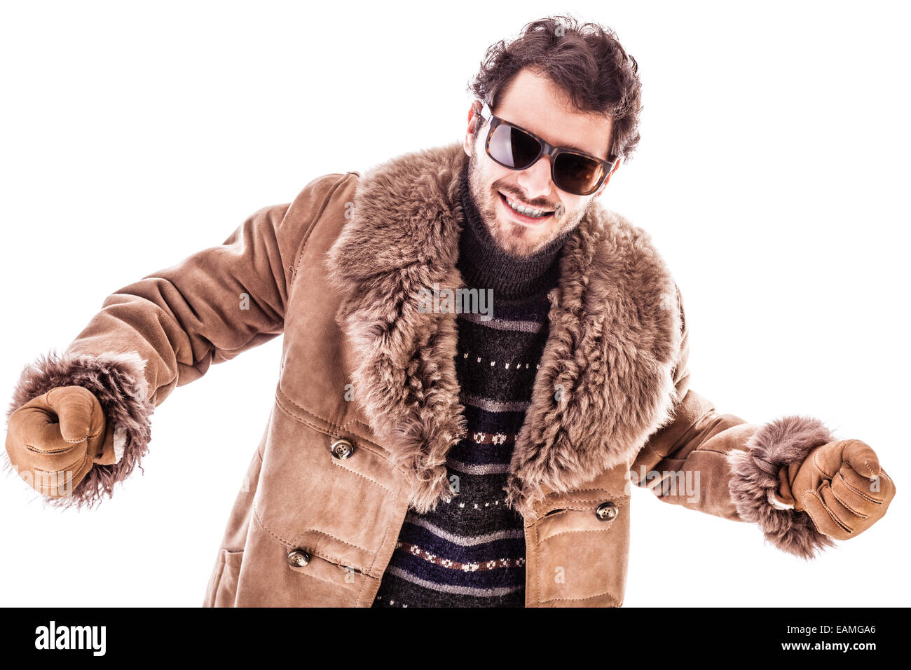 a young man wearing a sheepskin coat isolated over a white background ...