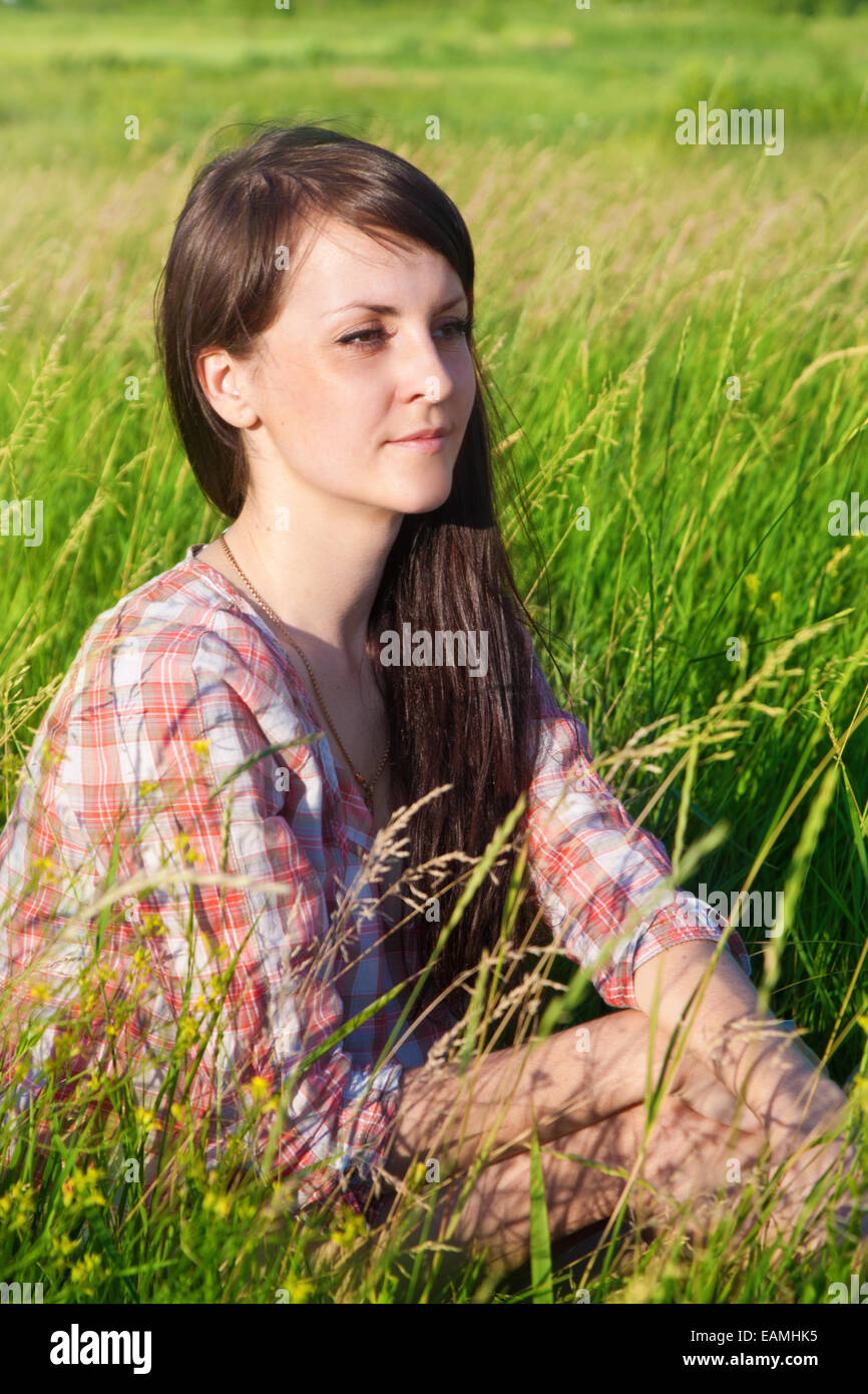 Portrait of a young smiling woman outdoors Stock Photo - Alamy