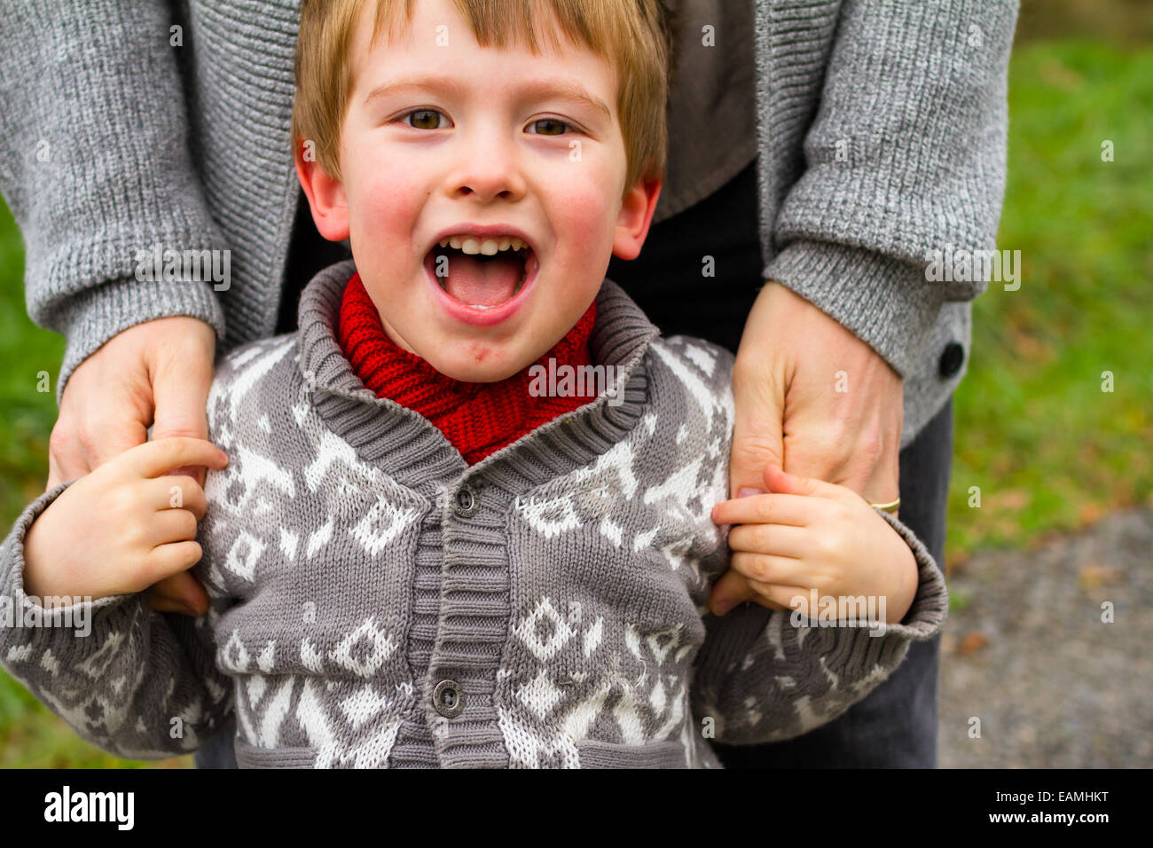 Dad and his son together in a lifestyle family portrait outdoors in the Fall. Stock Photo