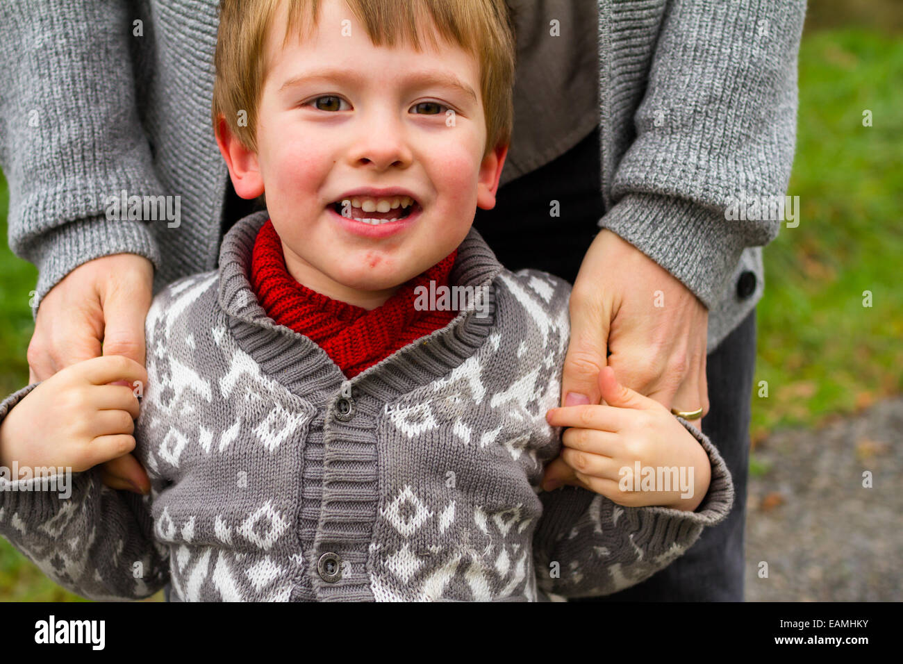 Dad and his son together in a lifestyle family portrait outdoors in the Fall. Stock Photo