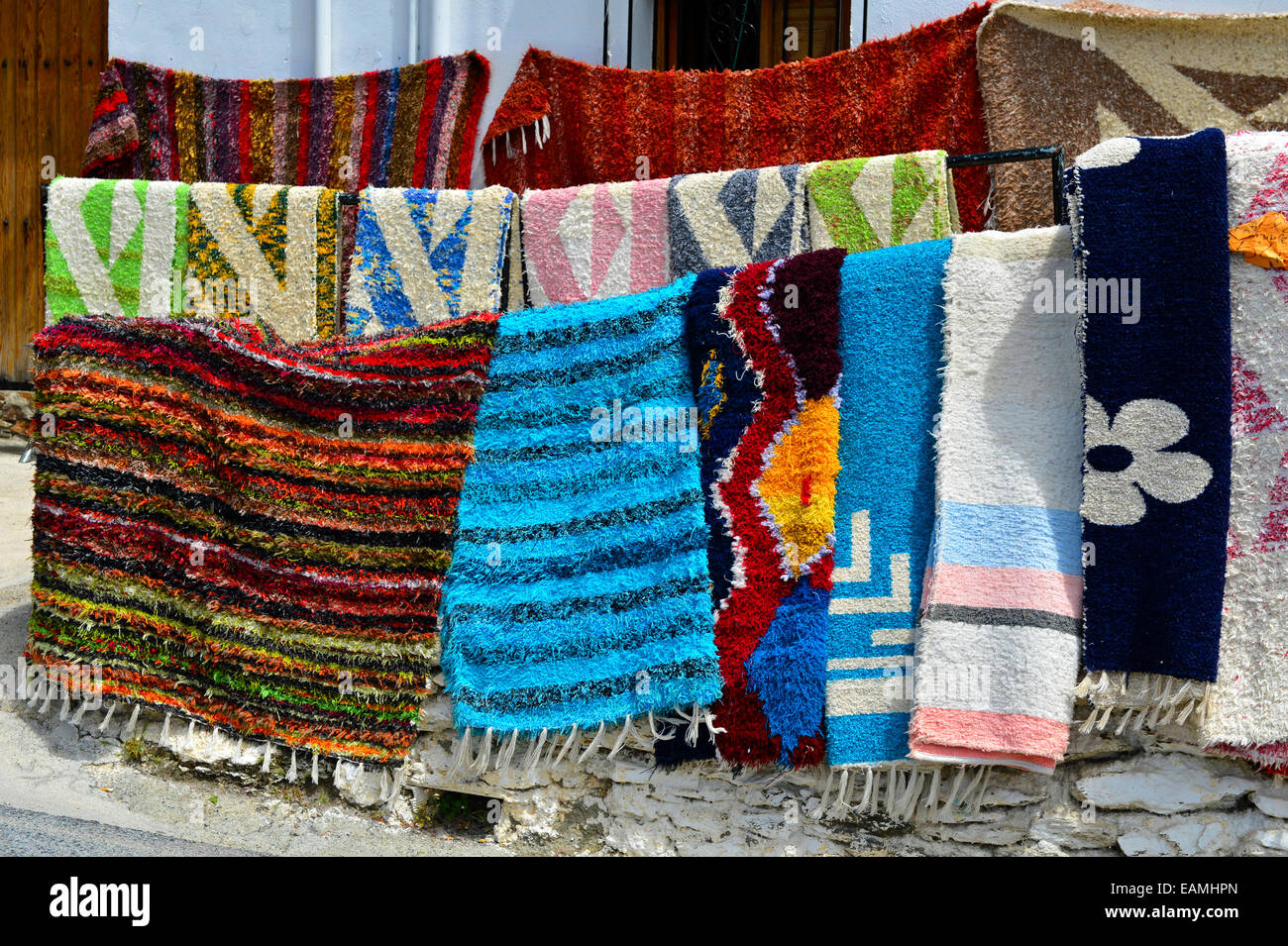 Colorful handwoven rugs for sale, Capileira, Alpujarras, Sierra Nevada, Spain Stock Photo
