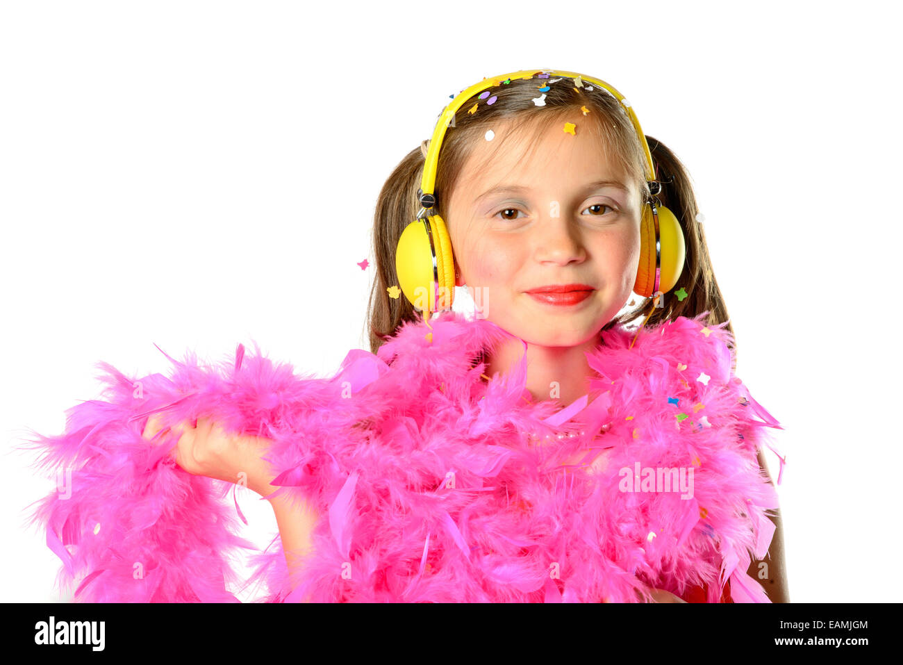 a pretty little girl with a pink feather boa on the white background Stock Photo