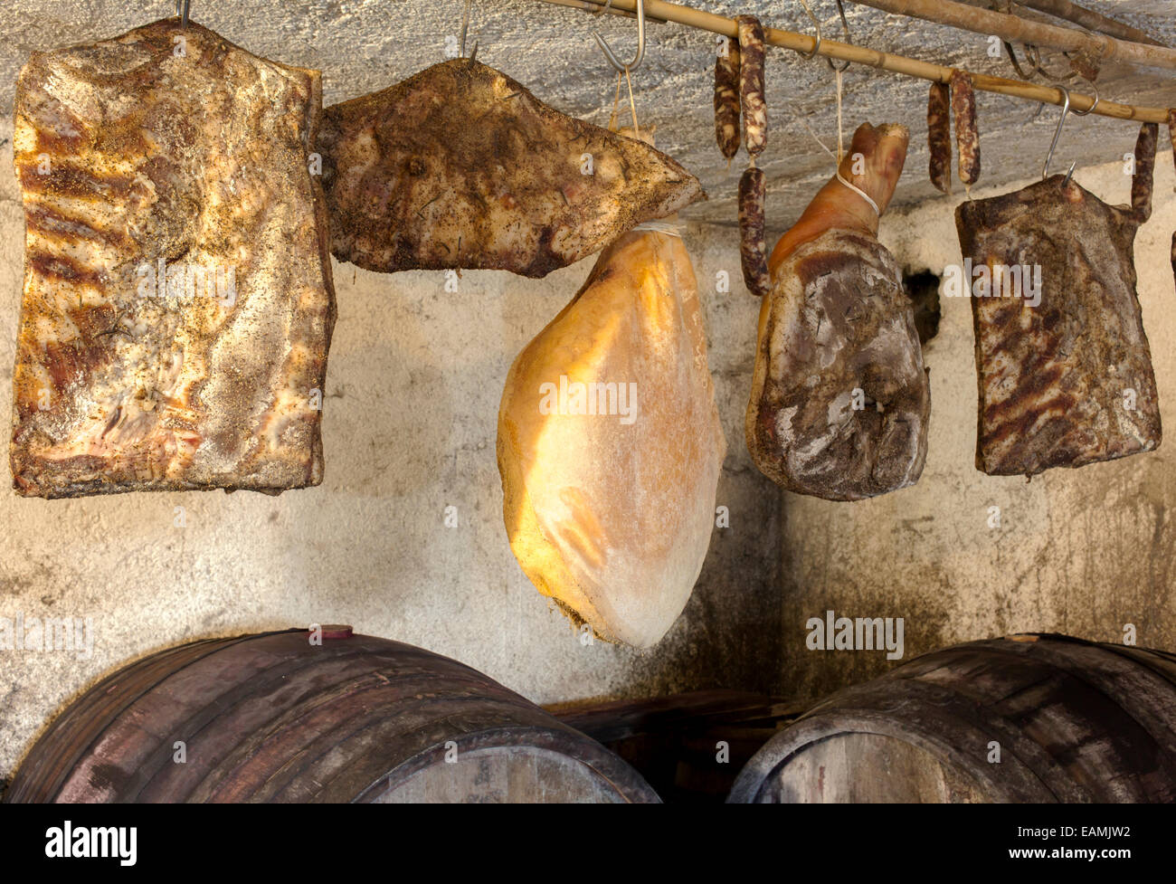 Interior of very old wine cellar with dried meat delicatessen Stock Photo