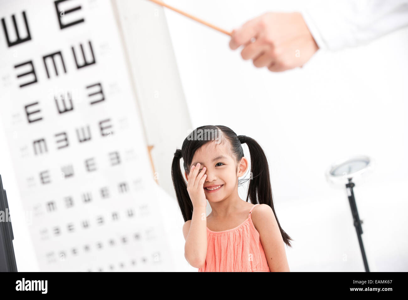 Oriental girls testing vision Stock Photo