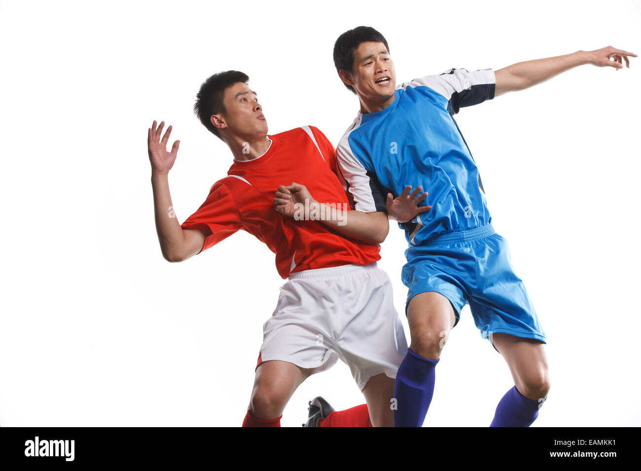 Two footballers to rob the ball Stock Photo