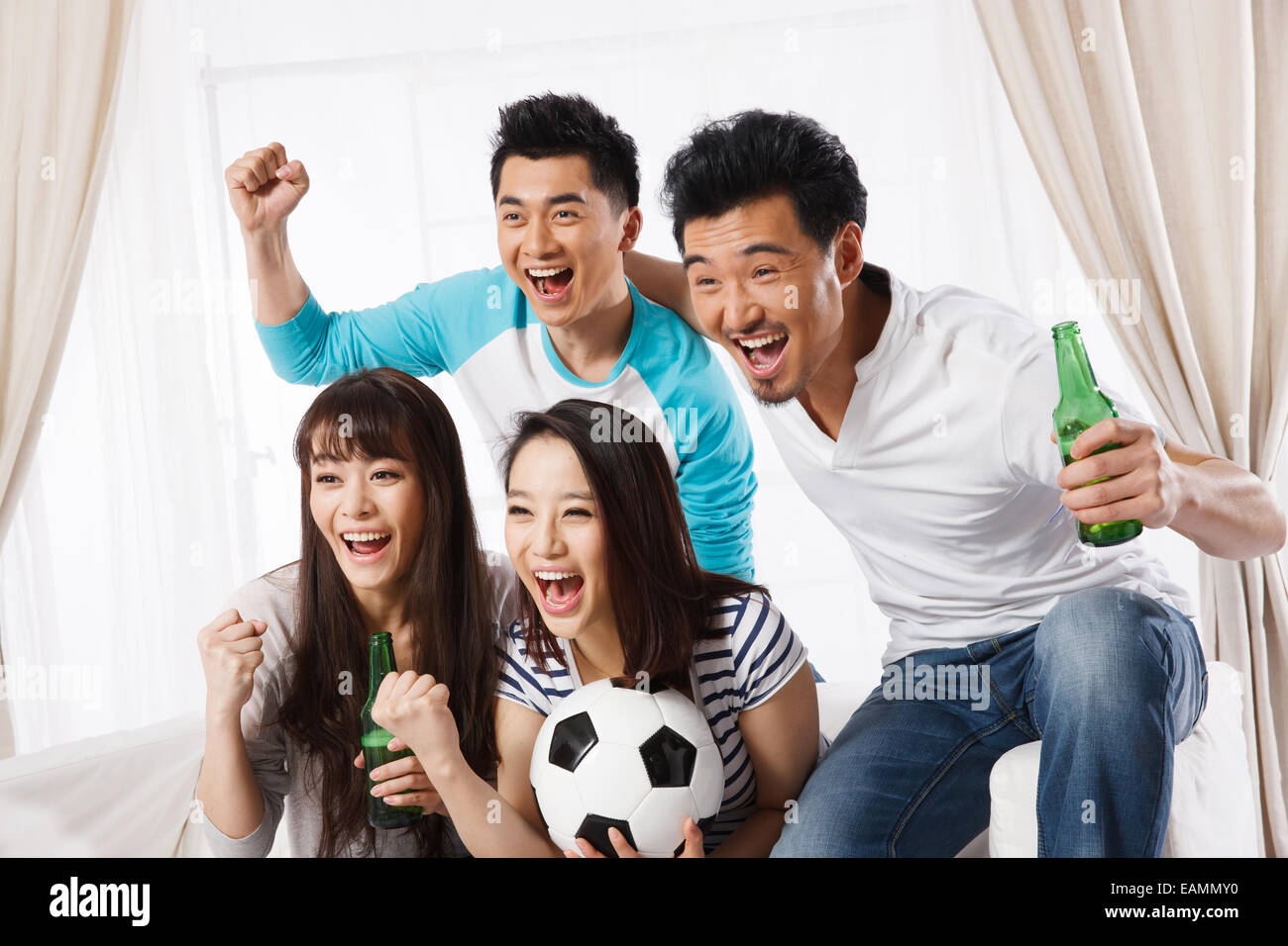 A group of fans are watching football games Stock Photo Alamy