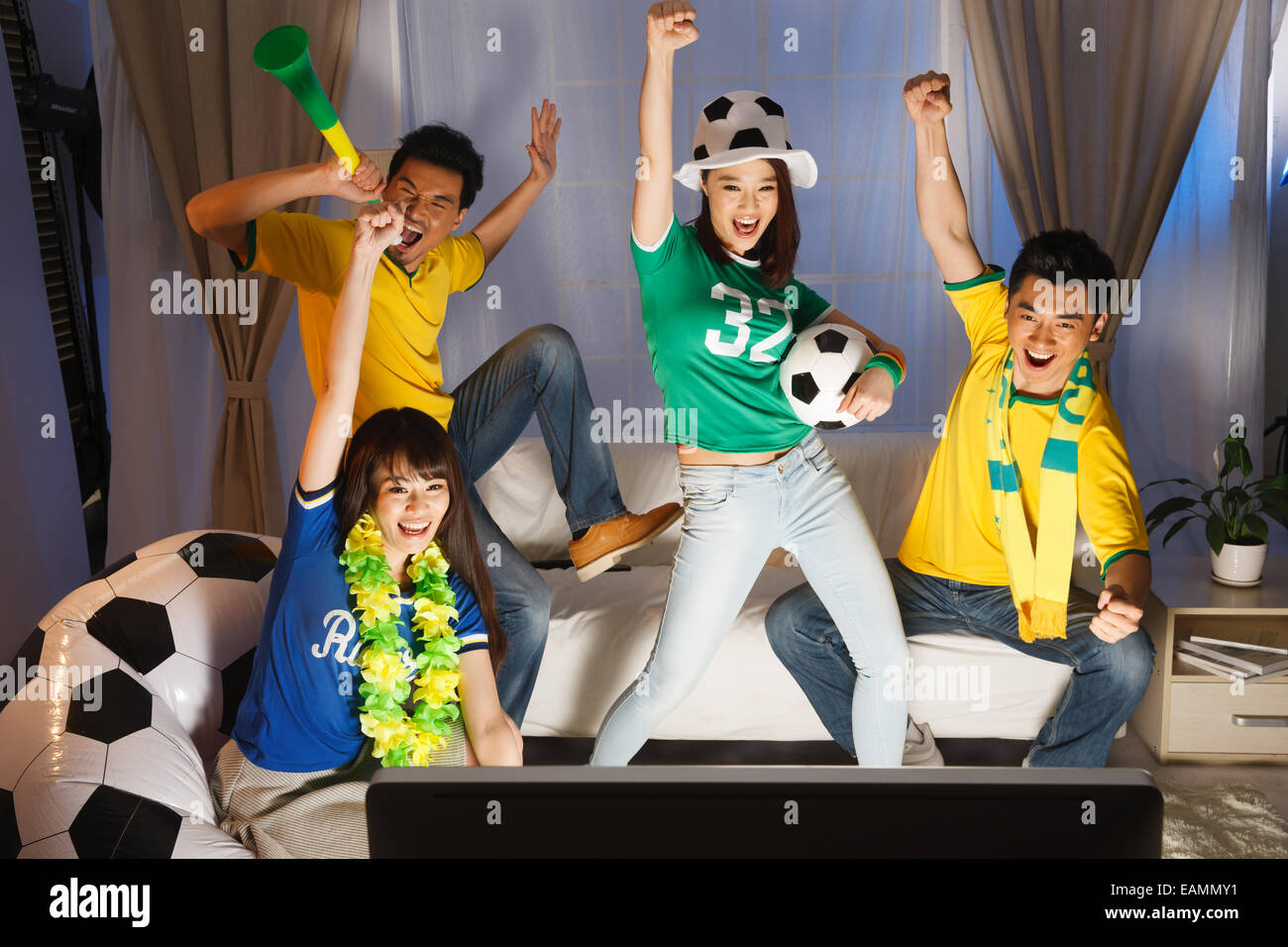 A group of fans are watching football games Stock Photo Alamy