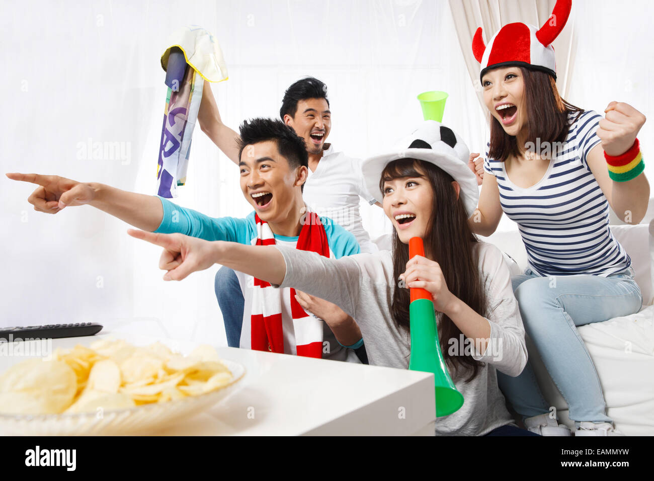 A group of fans are watching football games Stock Photo Alamy