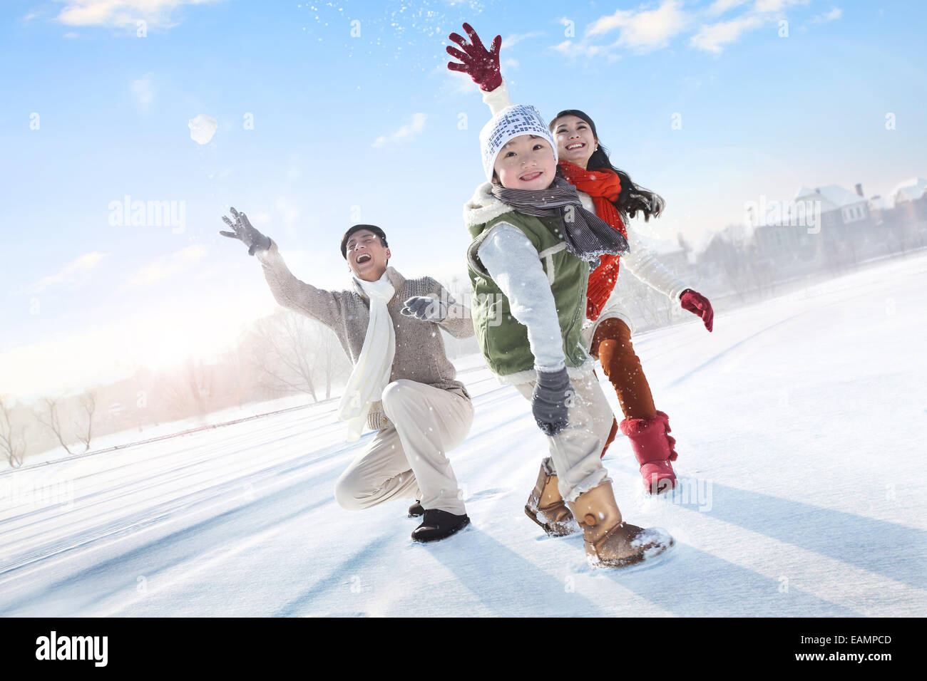 One-child families in the snow snowball fights Stock Photo