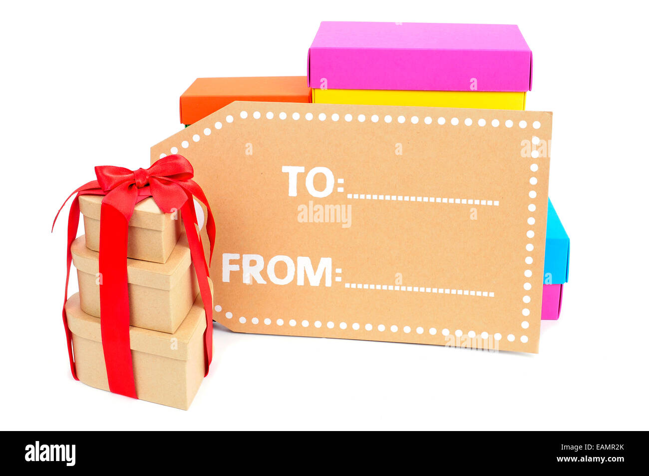 a pile of gift boxes of different sizes and colors and a blank label on
