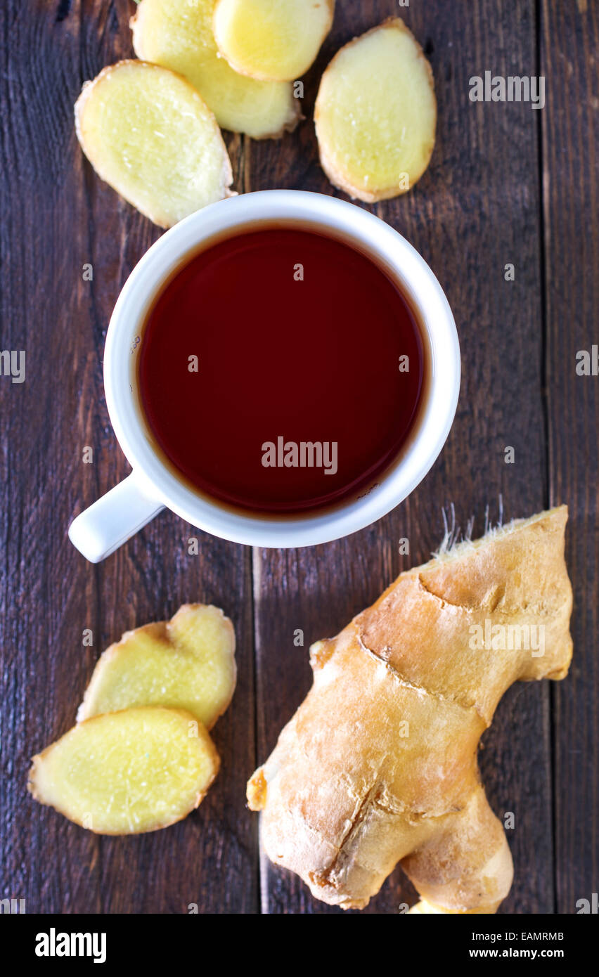 fresh tea in cup and ginger on a table Stock Photo - Alamy