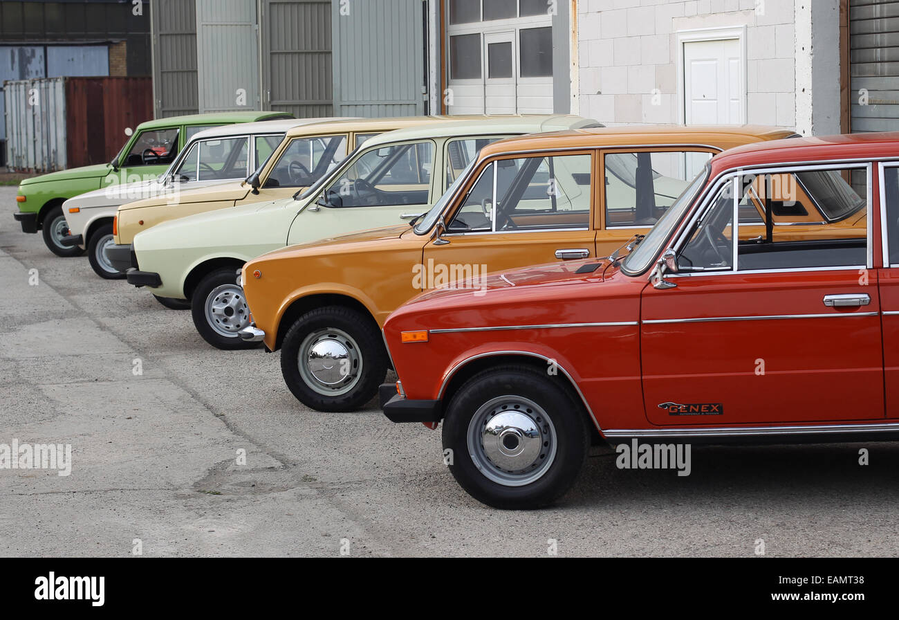 Leipzig, Germany. 02nd Oct, 2014. Old cars (L-R Wartburg 353, Lada 1500s, Wartburg 1, 3, Dacia 1300 TX, Shiguli/ Lada 1200, Lada 1500s) from the former Soviet Union and the GDR are on sale outside of a garage at Genex Automobile und Technik in Brandis near Leipzig, Germany, 02 October 2014. The Leipzig car dealer Gerrit Crummenerl sells cars from the former east block under the label Genex Autos. Photo: SEBASTIAN WILLNOW/ZB/dpa/Alamy Live News Stock Photo