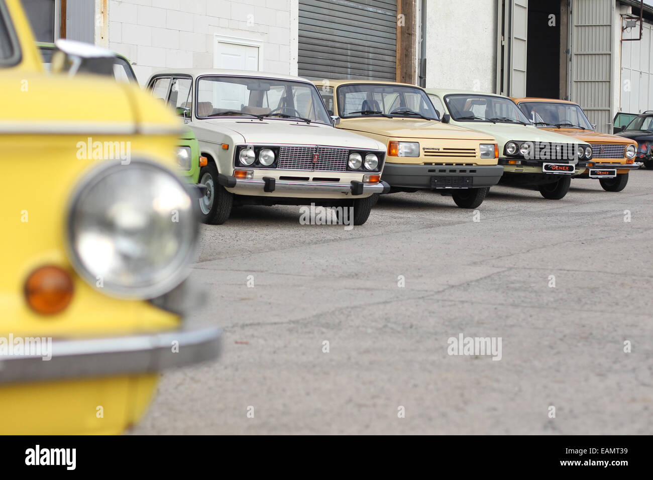 Leipzig, Germany. 02nd Oct, 2014. Old cars (L-R Saporoshez SAS 968A, Lada 1500s, Wartburg 1, 3, Dacia 1300 TX, Shiguli/ Lada 1200) from the former Soviet Union and the GDR are on sale outside of a garage at Genex Automobile und Technik in Brandis near Leipzig, Germany, 02 October 2014. The Leipzig car dealer Gerrit Crummenerl sells cars from the former east block under the label Genex Autos. Photo: SEBASTIAN WILLNOW/ZB/dpa/Alamy Live News Stock Photo