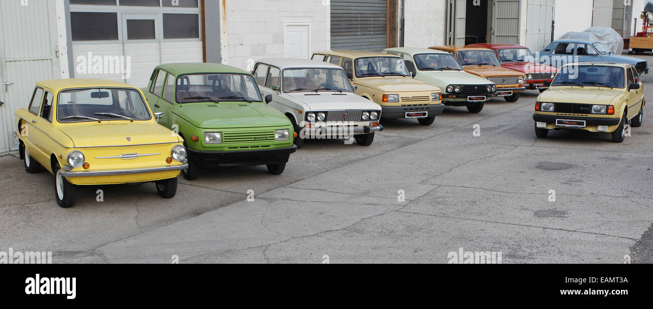 Leipzig, Germany. 02nd Oct, 2014. Old cars (L-R Saporoshez SAS 968A, Lada 1500s, Wartburg 1, 3, Dacia 1300 TX, Shiguli/ Lada 1200, Dacia 1300 TX, Skoda Rapid) from the former Soviet Union and the GDR are on sale outside of a garage at Genex Automobile und Technik in Brandis near Leipzig, Germany, 02 October 2014. The Leipzig car dealer Gerrit Crummenerl sells cars from the former east block under the label Genex Autos. Photo: SEBASTIAN WILLNOW/ZB/dpa/Alamy Live News Stock Photo