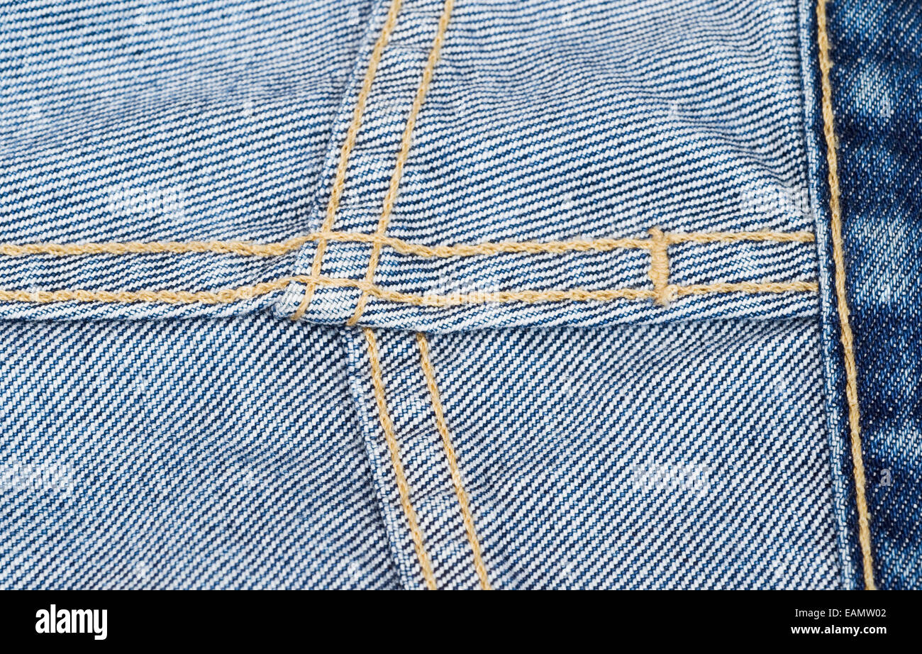Turned denim trousers detail Stock Photo