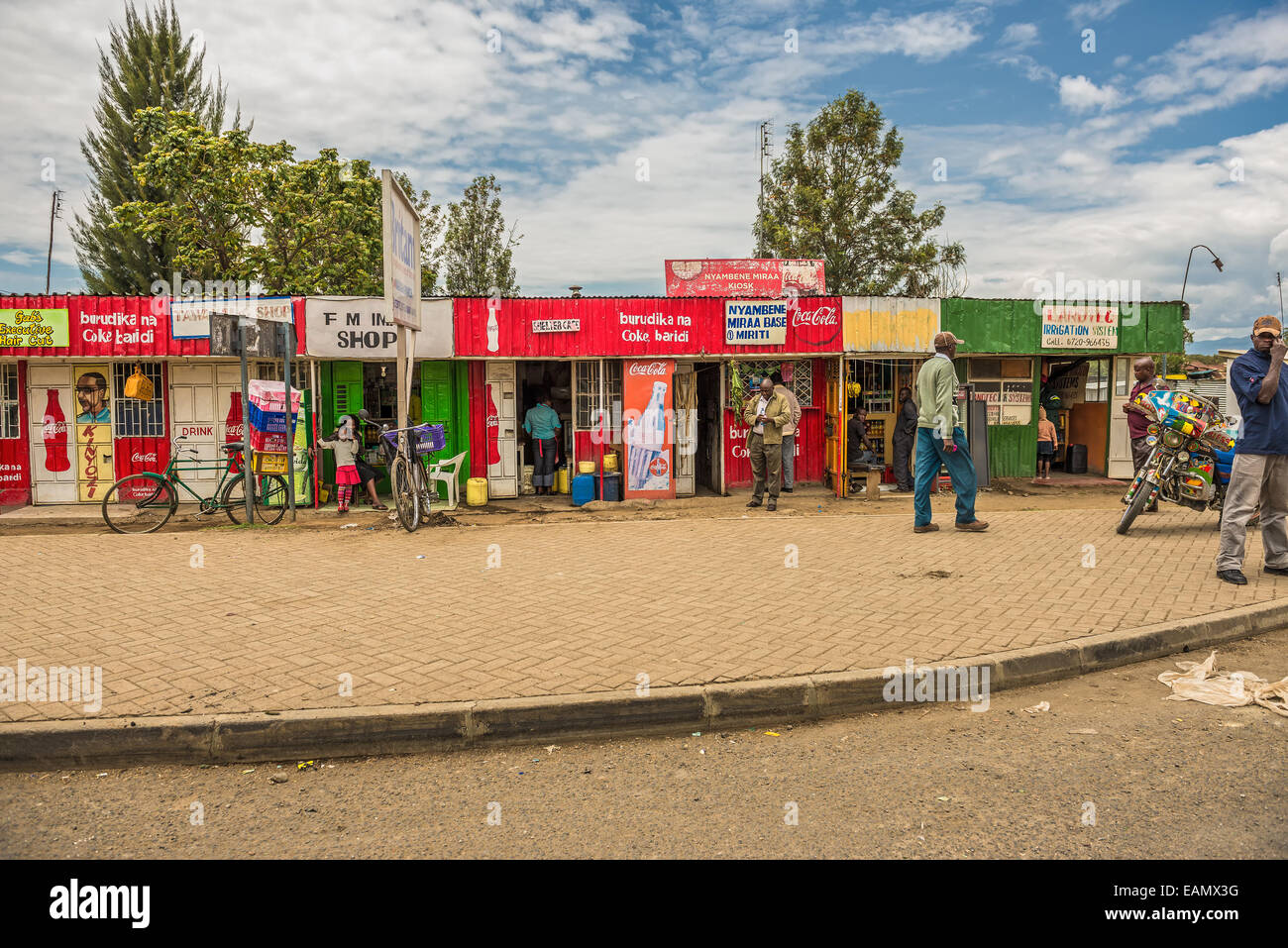 Typical shopping street scene with pedestrians in Naivasha, Kenya Stock Photo
