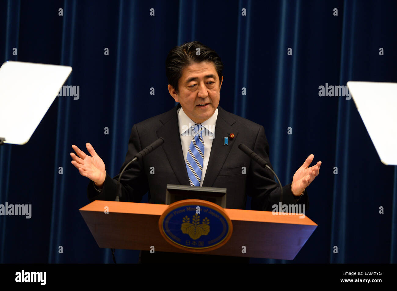 Tokyo, Japan. 18th Nov, 2014. Japanese Prime Minister Shinzo Abe addresses a press conference in Tokyo, Japan, Nov. 18, 2014. Japanese Prime Minister Shinzo Abe on Tuesday told a press conference that he would dissolve the lower house on Nov. 21 and decided to postpone the second round sales tax hike by 18 months, in the wake of the country's severe economic situation. Credit:  Ma Ping/Xinhua/Alamy Live News Stock Photo