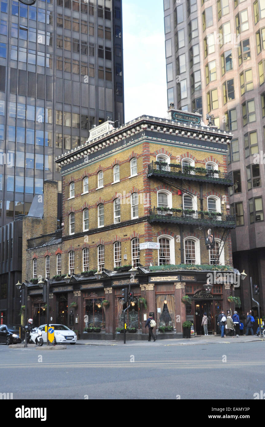 THE ALBERT- A WELL KNOWN VICTORIAN LONDON  PUB SURROUNDED BY TALL BUILDINGS VICTORIA ST  LONDON UK Stock Photo