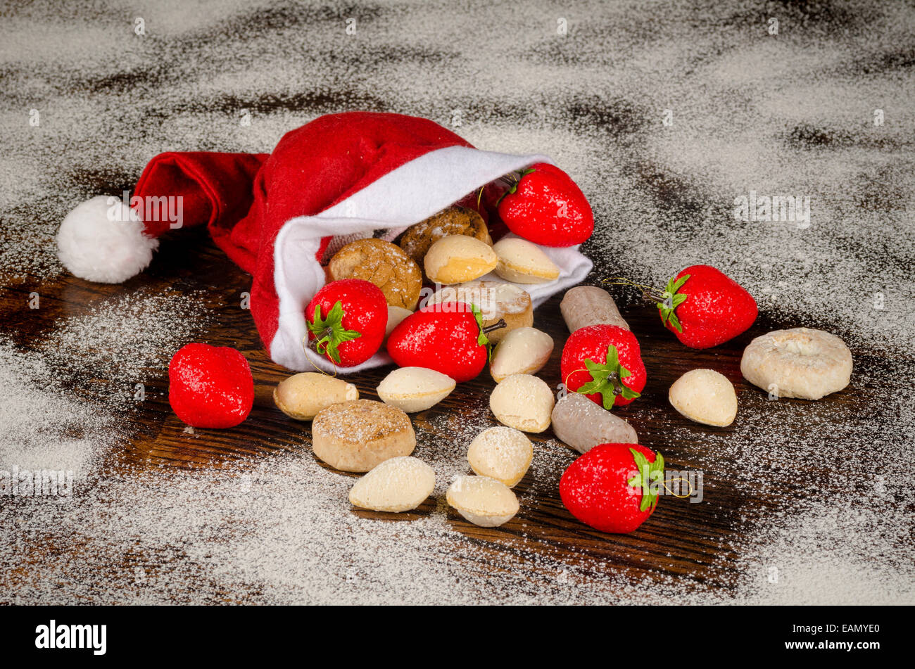 Traditional Spanish Christmas sweets pouring out of a Santa hat Stock