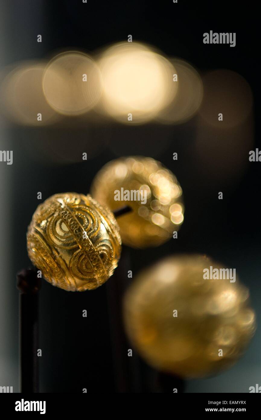 Stuttgart, Germany. 18th Nov, 2014. Three gold beads are on display in