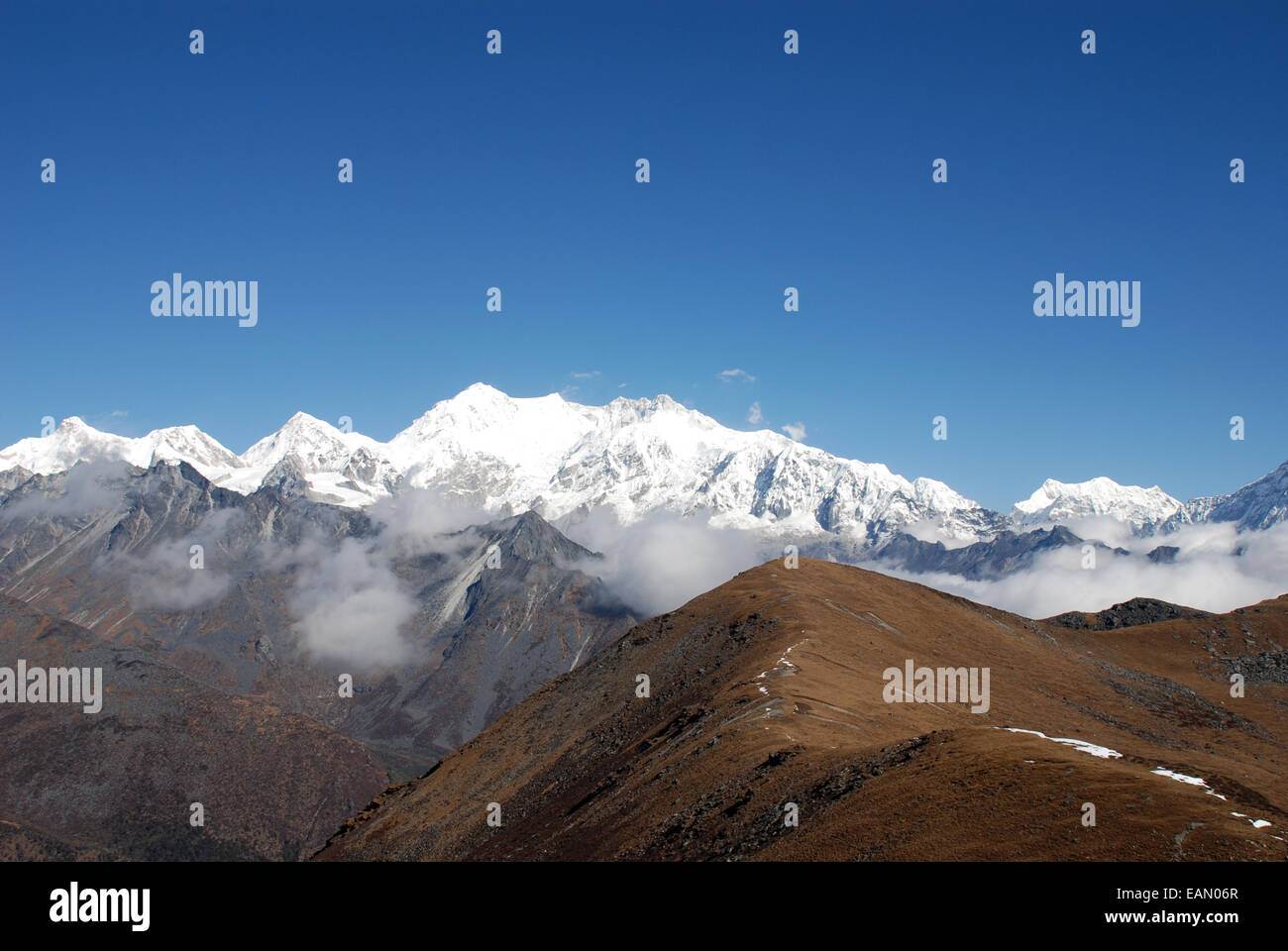 Kangchenjunga and the surrounding high Himalayan peaks are seen from A high point on the Singalila ridge in India Stock Photo
