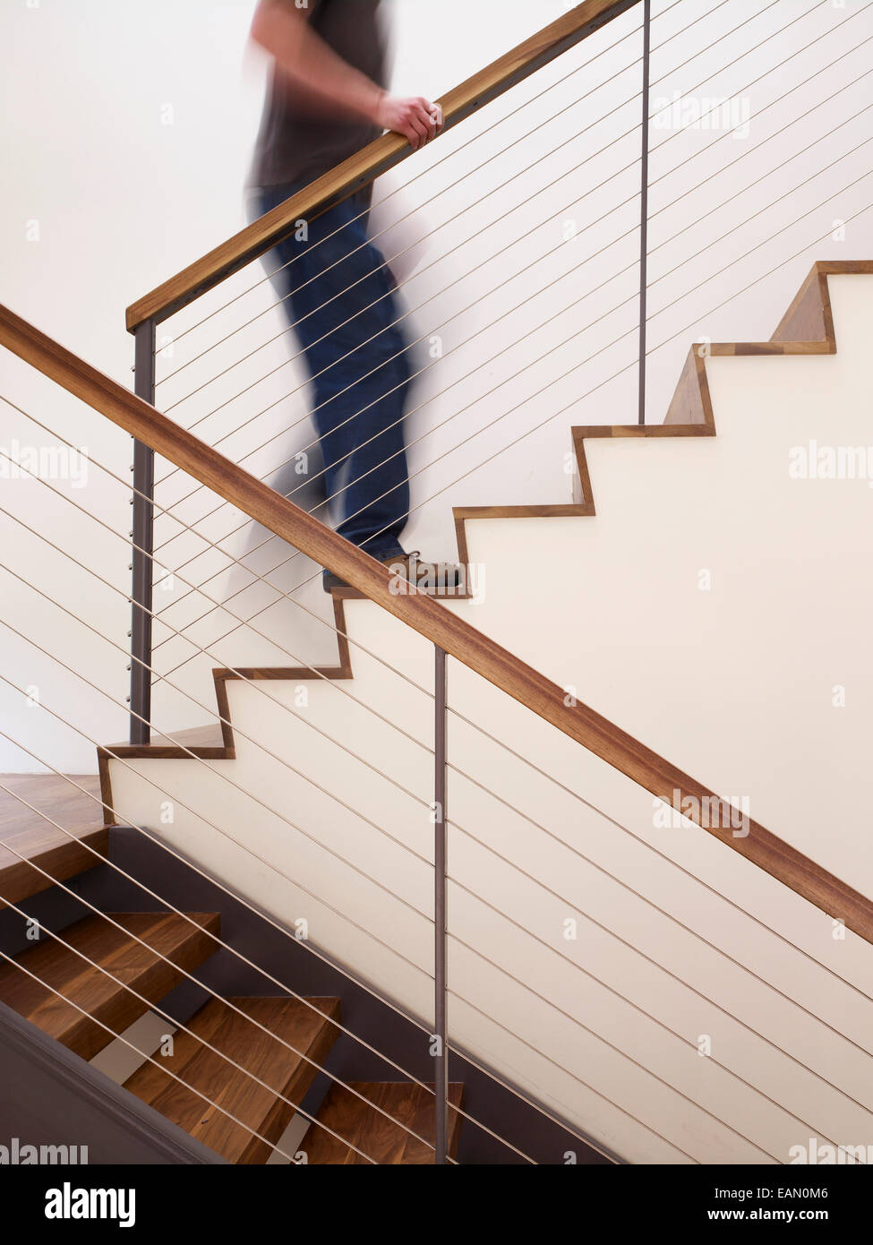 Man walking up apartment stairs hi-res stock photography and images - Alamy