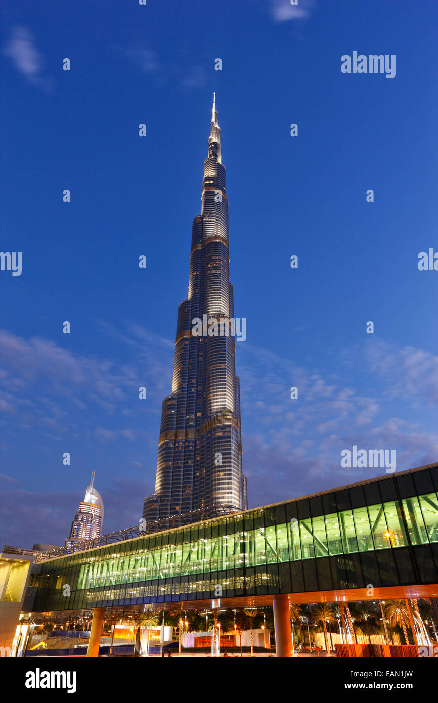 Modern architecture. Gangway to Dubai Mall and the tallest building  Burj Khalifa on the background in Dubai. Stock Photo
