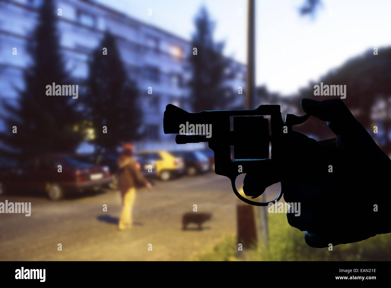 Robbery in store. Robber is aiming and threatening with gun in shop. Stock  Photo