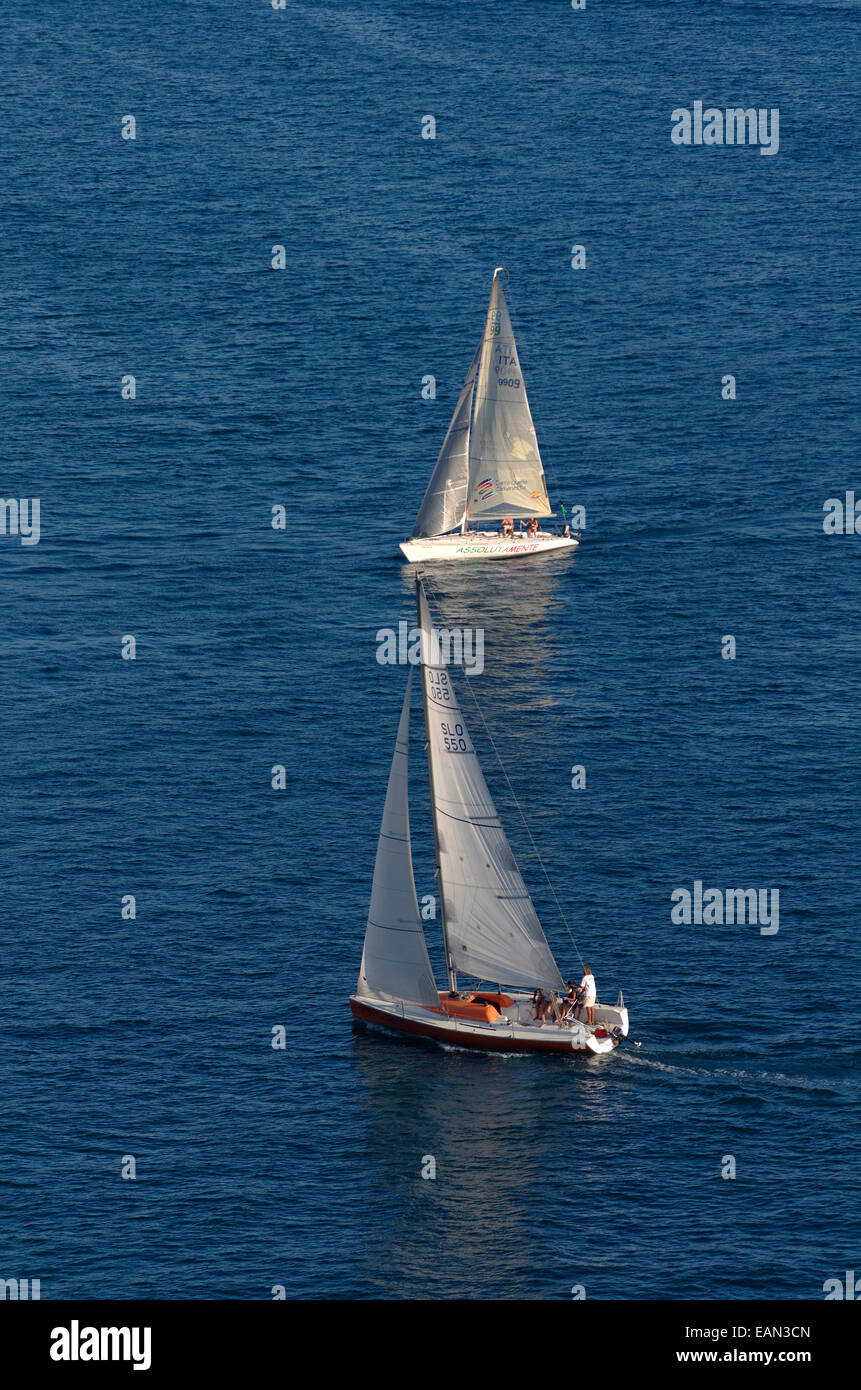 Sailing yacht cruiser/racers sailing on a collision course with close hauled boat in foreground having 'Right of Way'. Stock Photo