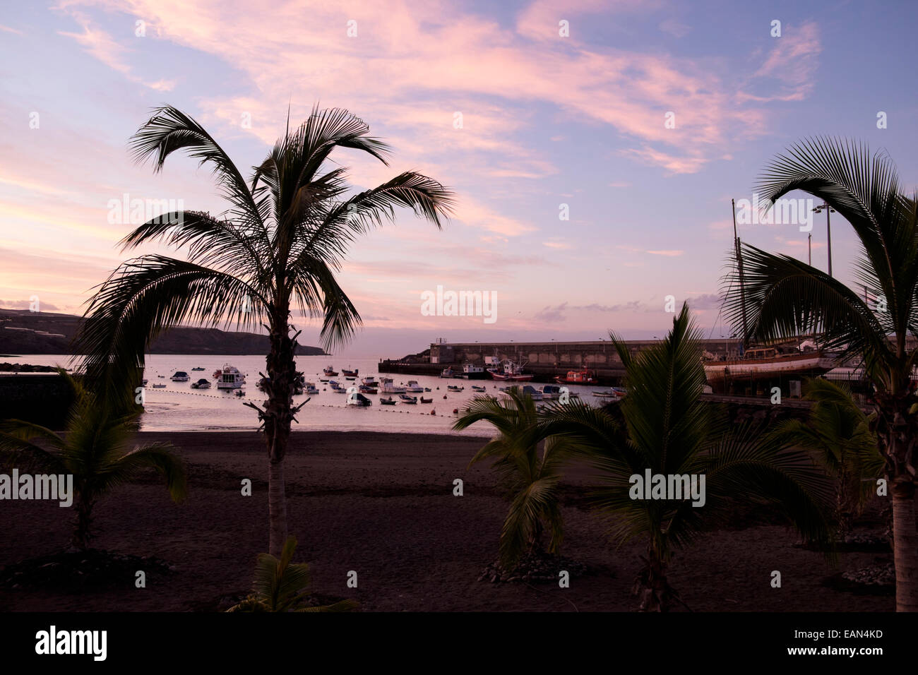 Red sky at dawn over Playa San Juan beach and harbour, Tenerife, Canary Islands, Spain. Stock Photo
