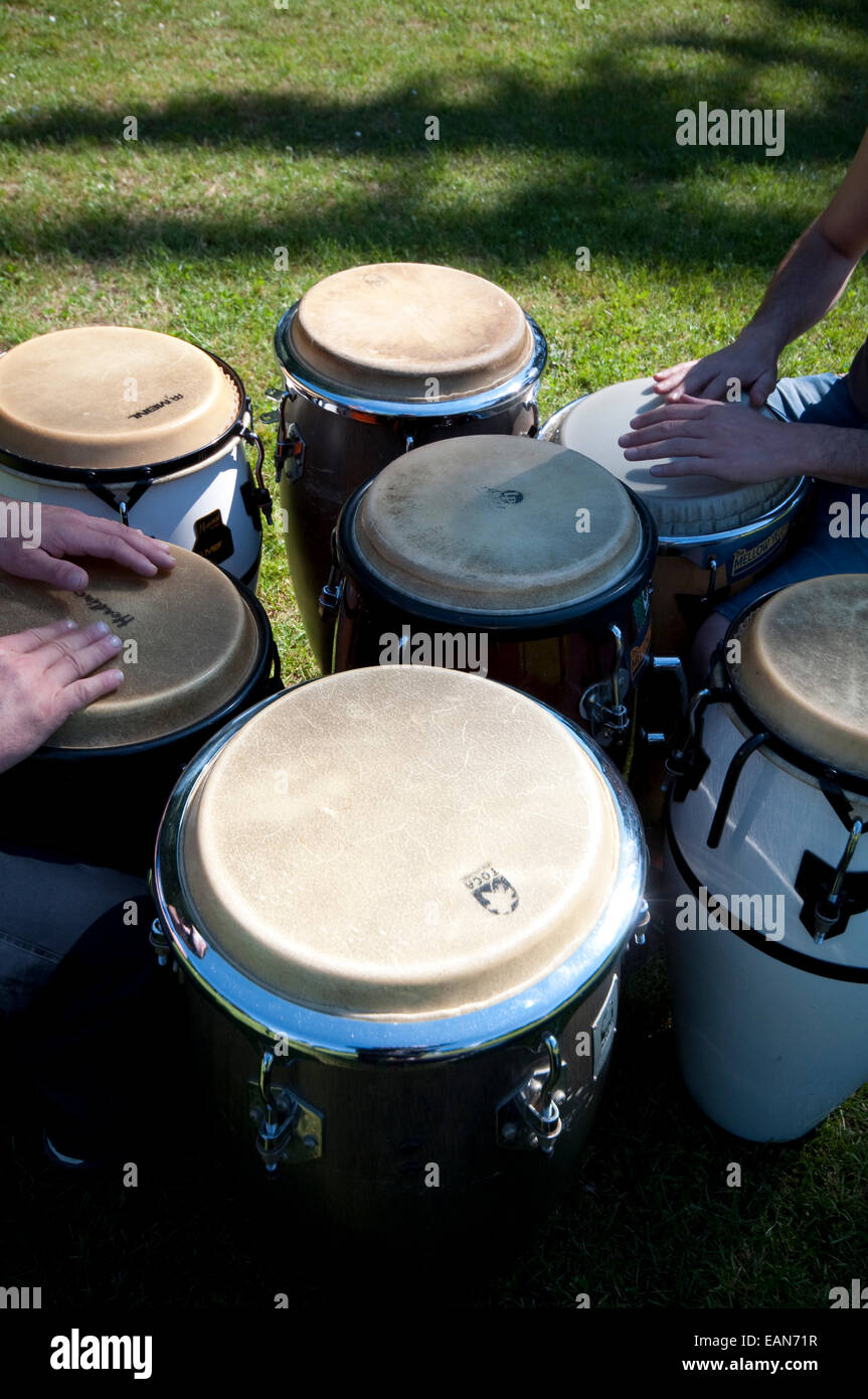 Musician  Playing a Bongo Drum. Stock Photo