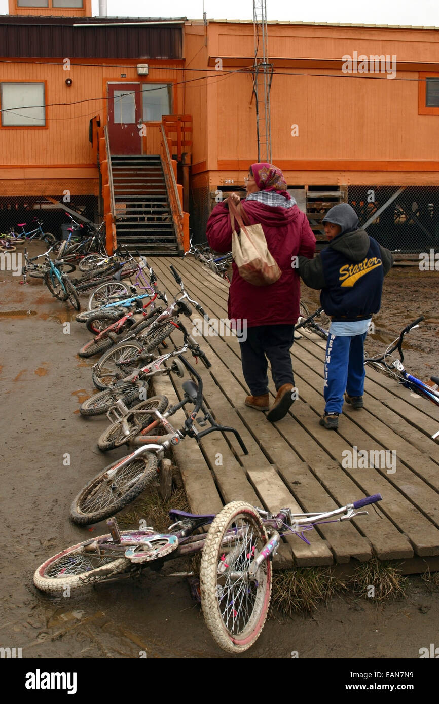 Bicycles Laying Next To Boardwalk As Two Children Are Entering Their