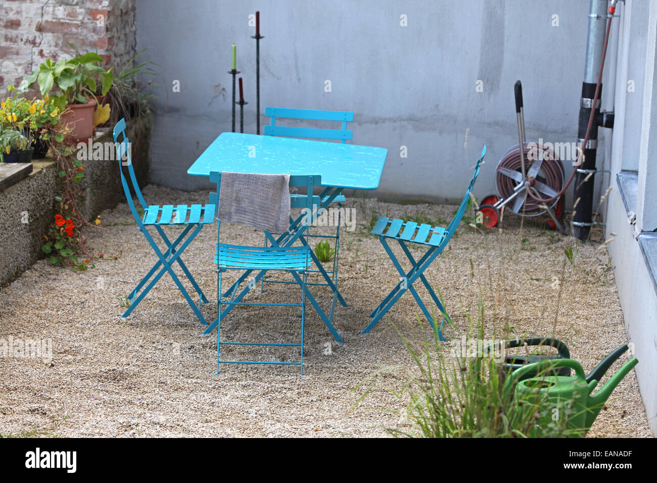 Scenic garden terrace with designer table and chairs Stock Photo