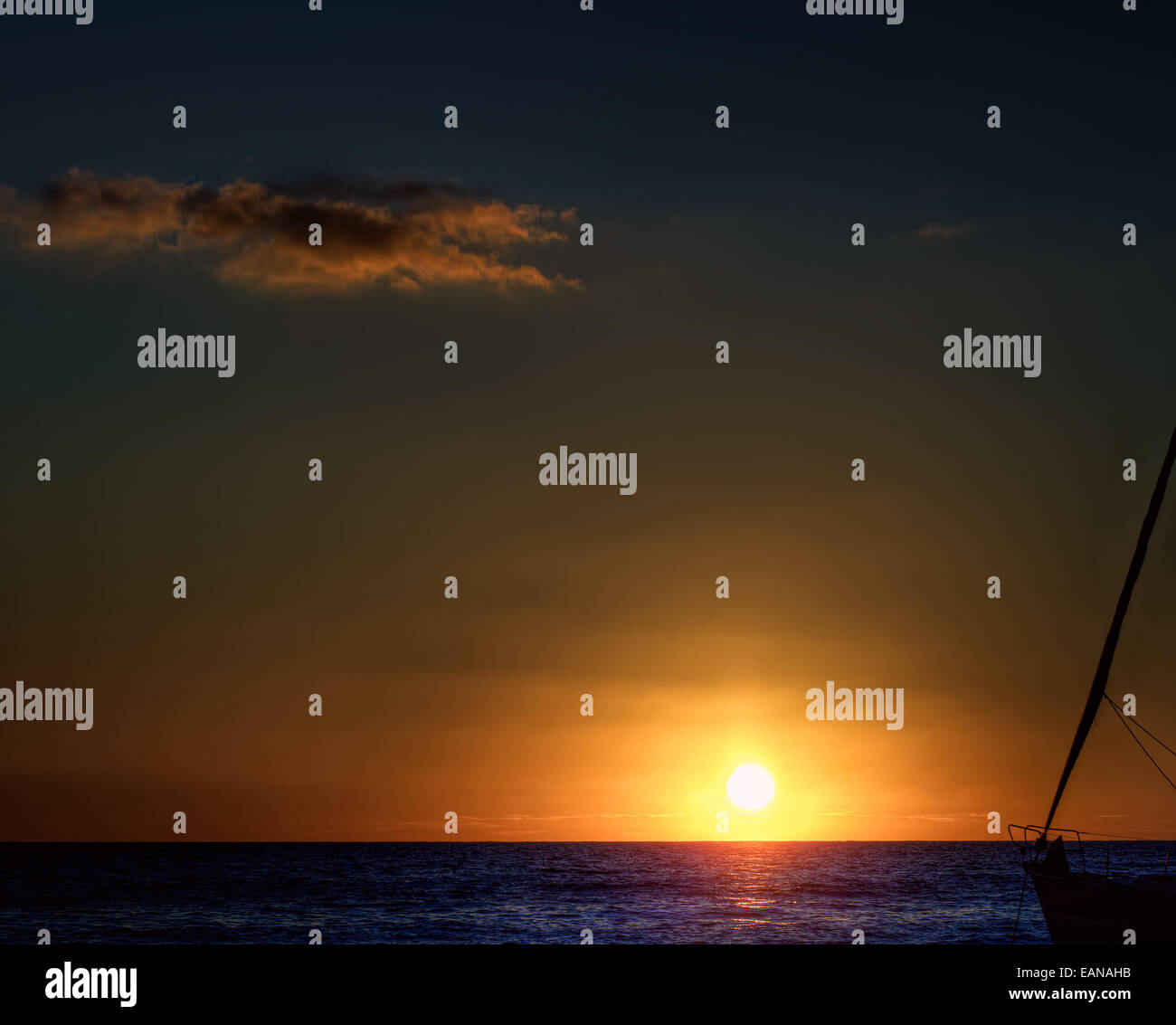 Sailing Yacht in the sea at sunset Stock Photo - Alamy