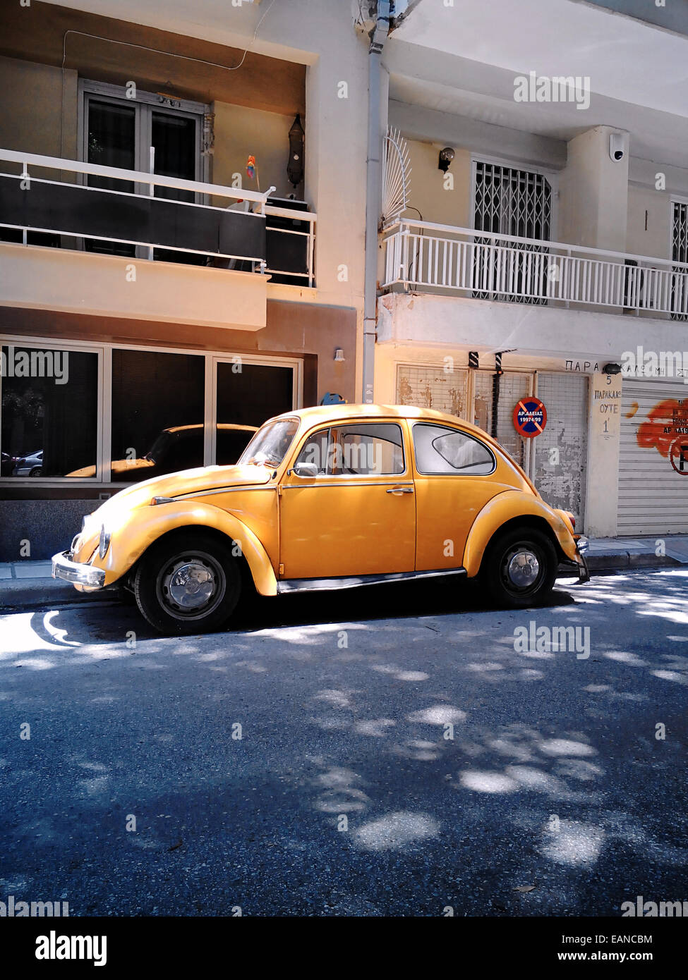 A yellow VW Beetle classic old car parked in Thessaloniki Stock Photo ...