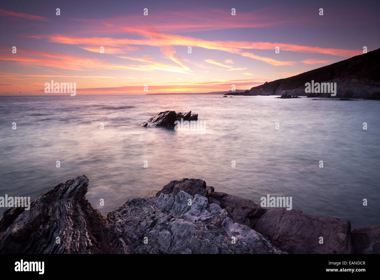 Sunset over Freathy Beach Whitsand Bay Cornwall UK Stock Photo