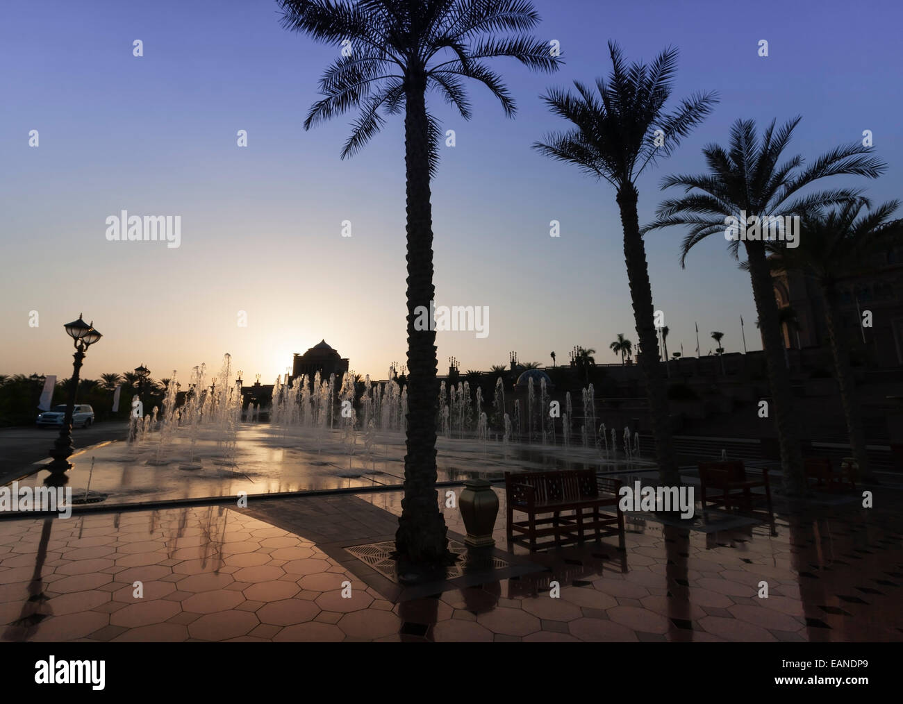 The Emirates Palace Hotel, Abu Dhabi, United Arab Emirates. Fountains at sunset. Stock Photo