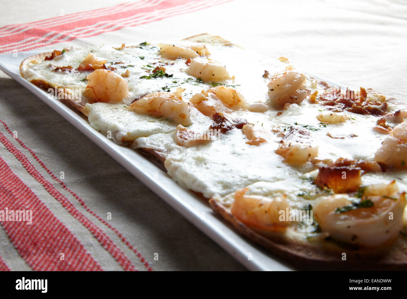Shrimp flatbread with cilantro white cheddar Parmesan bacon Stock Photo