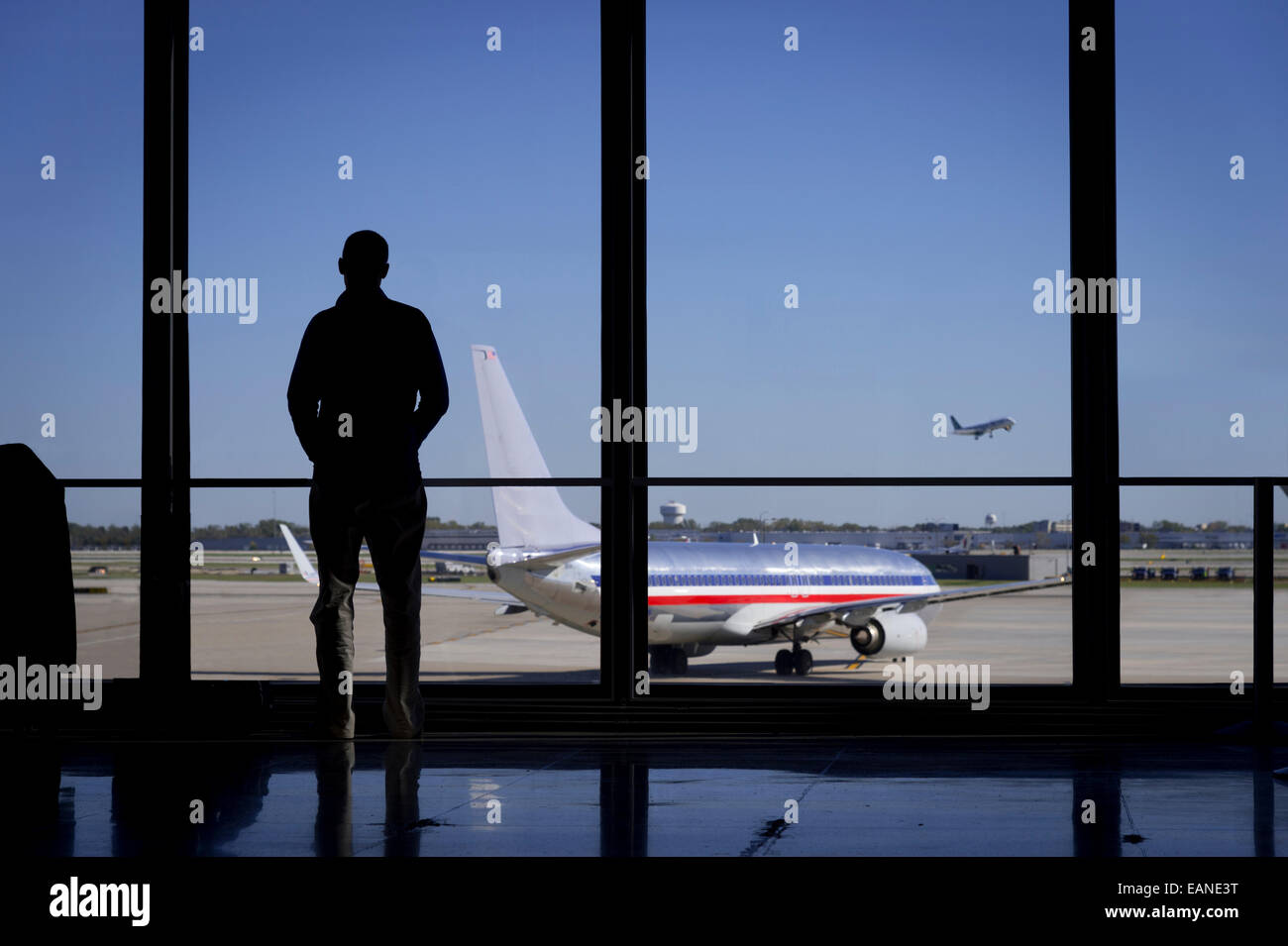 Grayscale photo of man standing near window photo – Free Cloud