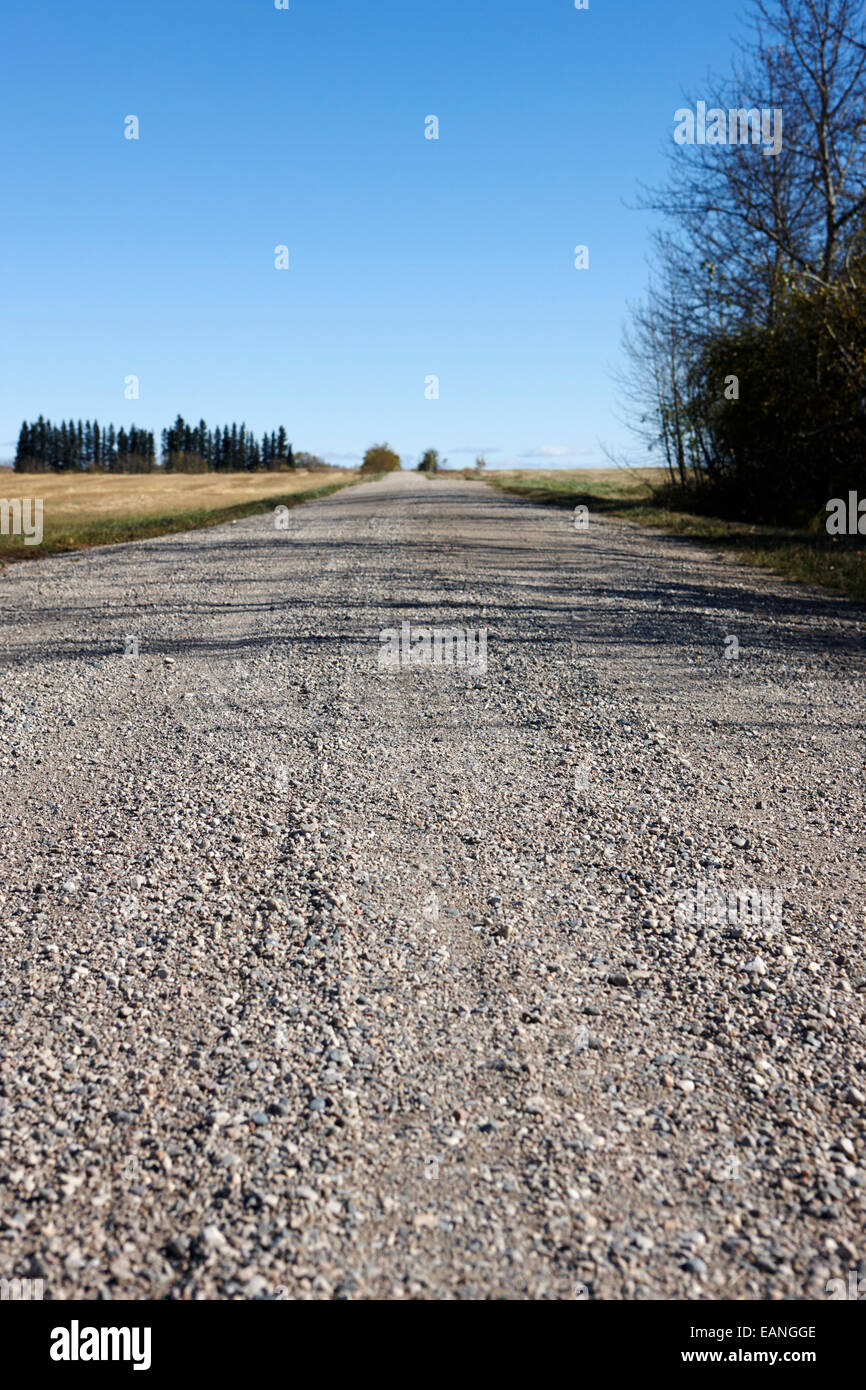 rough rural unpaved gravel road in remote Saskatchewan Canada Stock