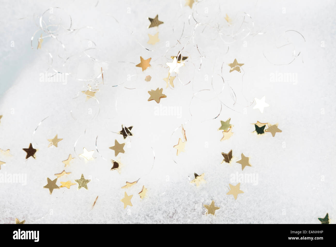 Christmas background with golden stars in the snow Stock Photo - Alamy