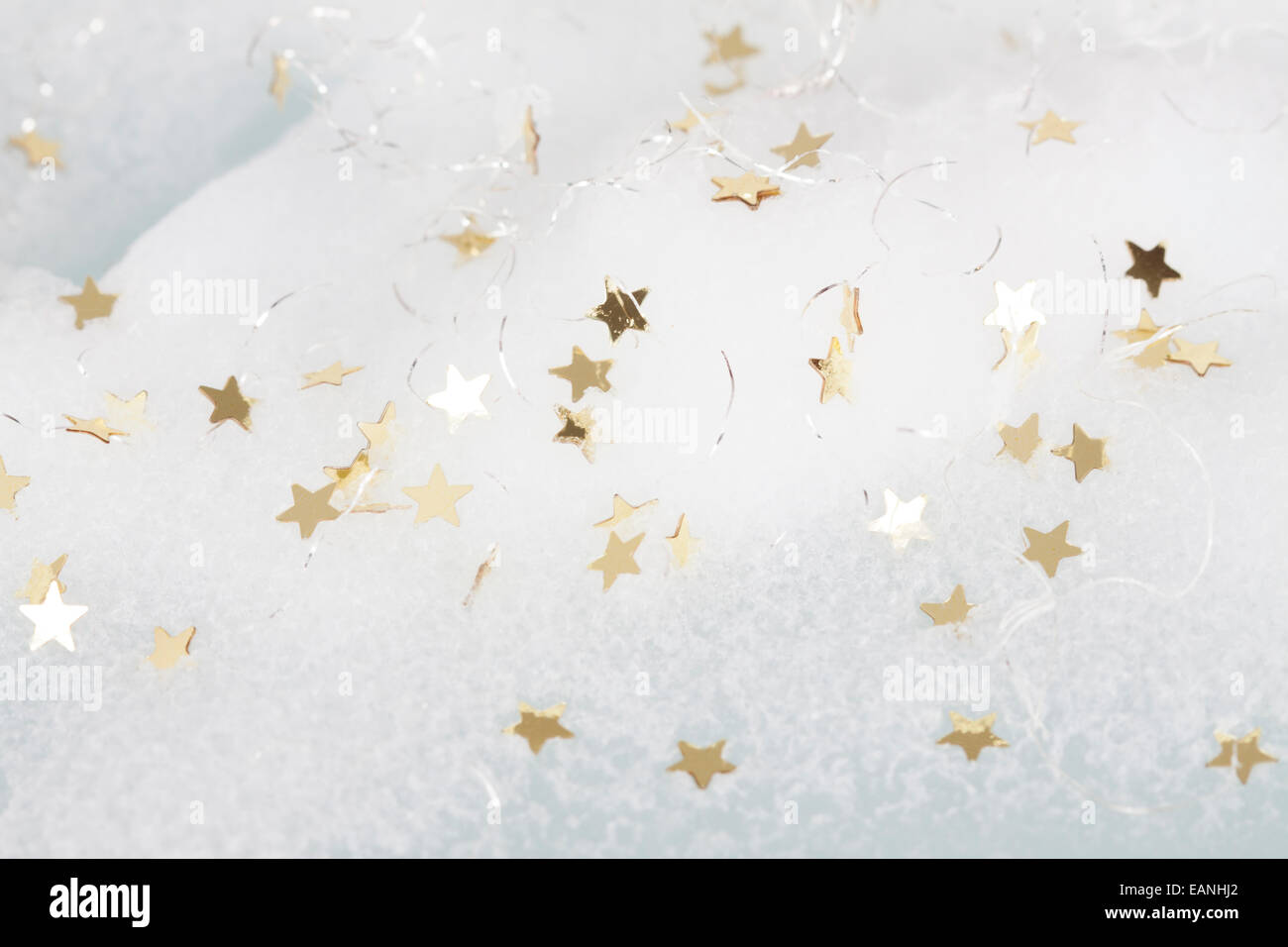 Christmas background with golden stars in the snow Stock Photo - Alamy
