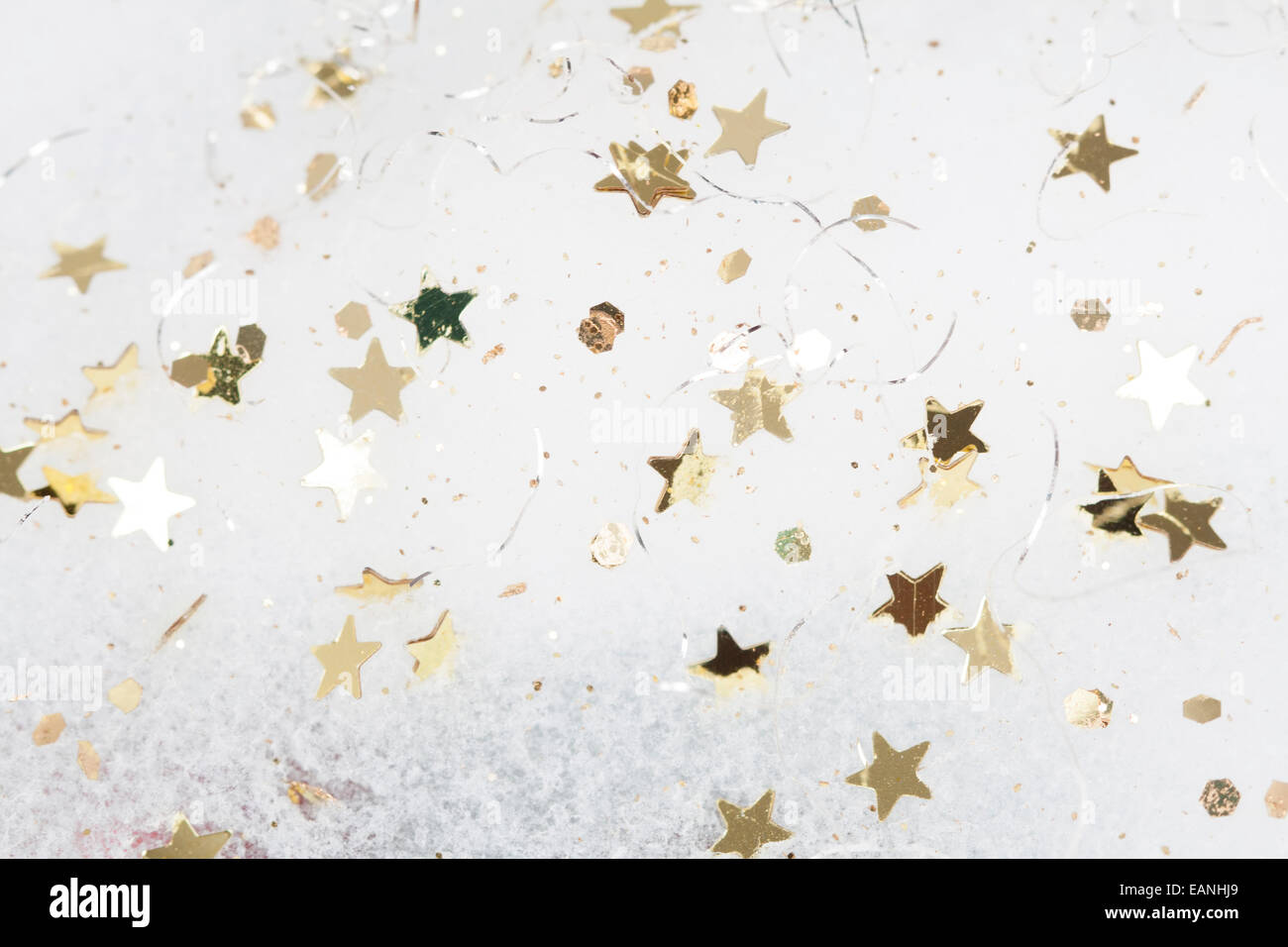 Christmas background with golden stars in the snow Stock Photo - Alamy