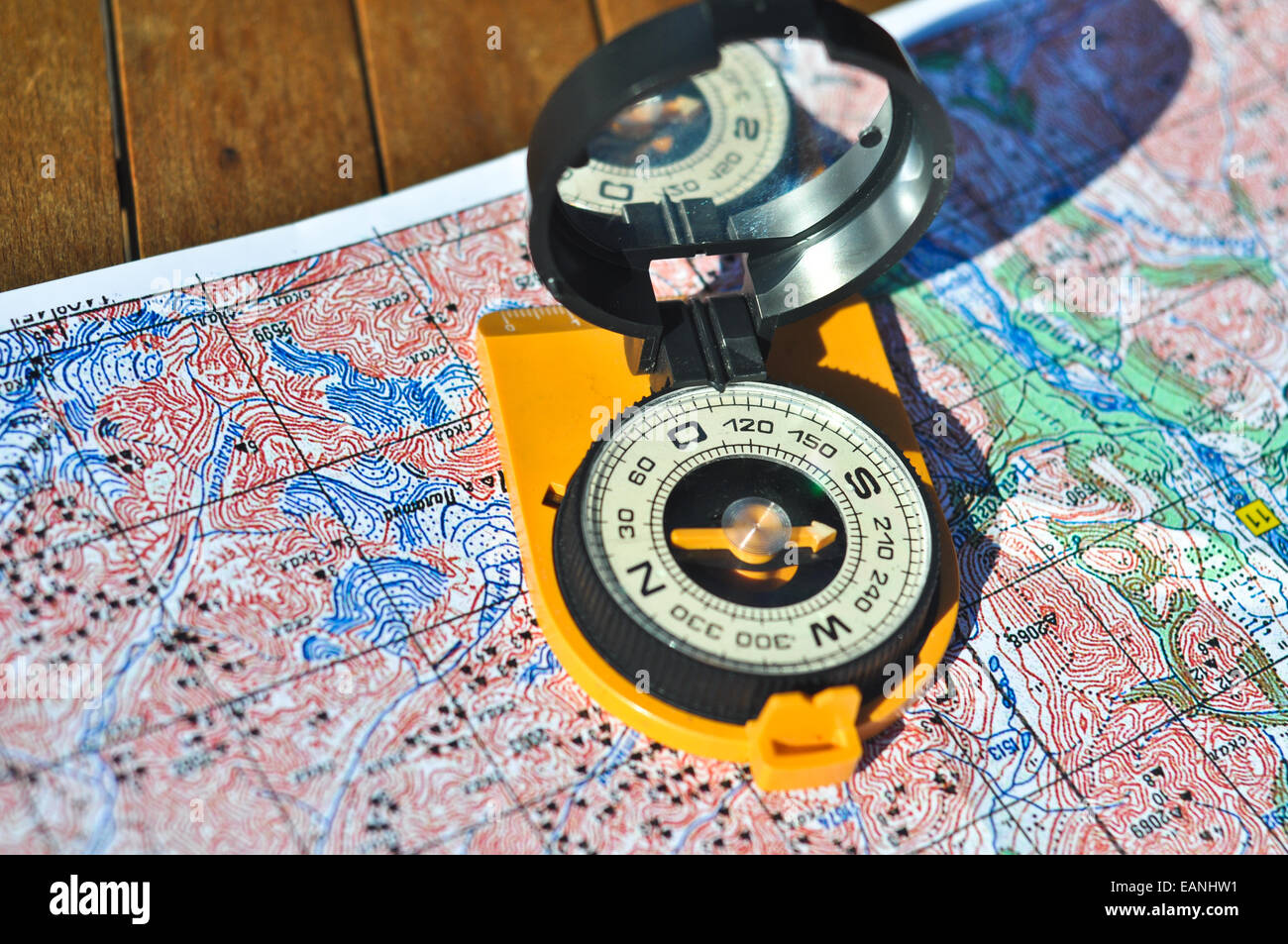 Compass and map. The magnetic compass is located on the topographic map ...